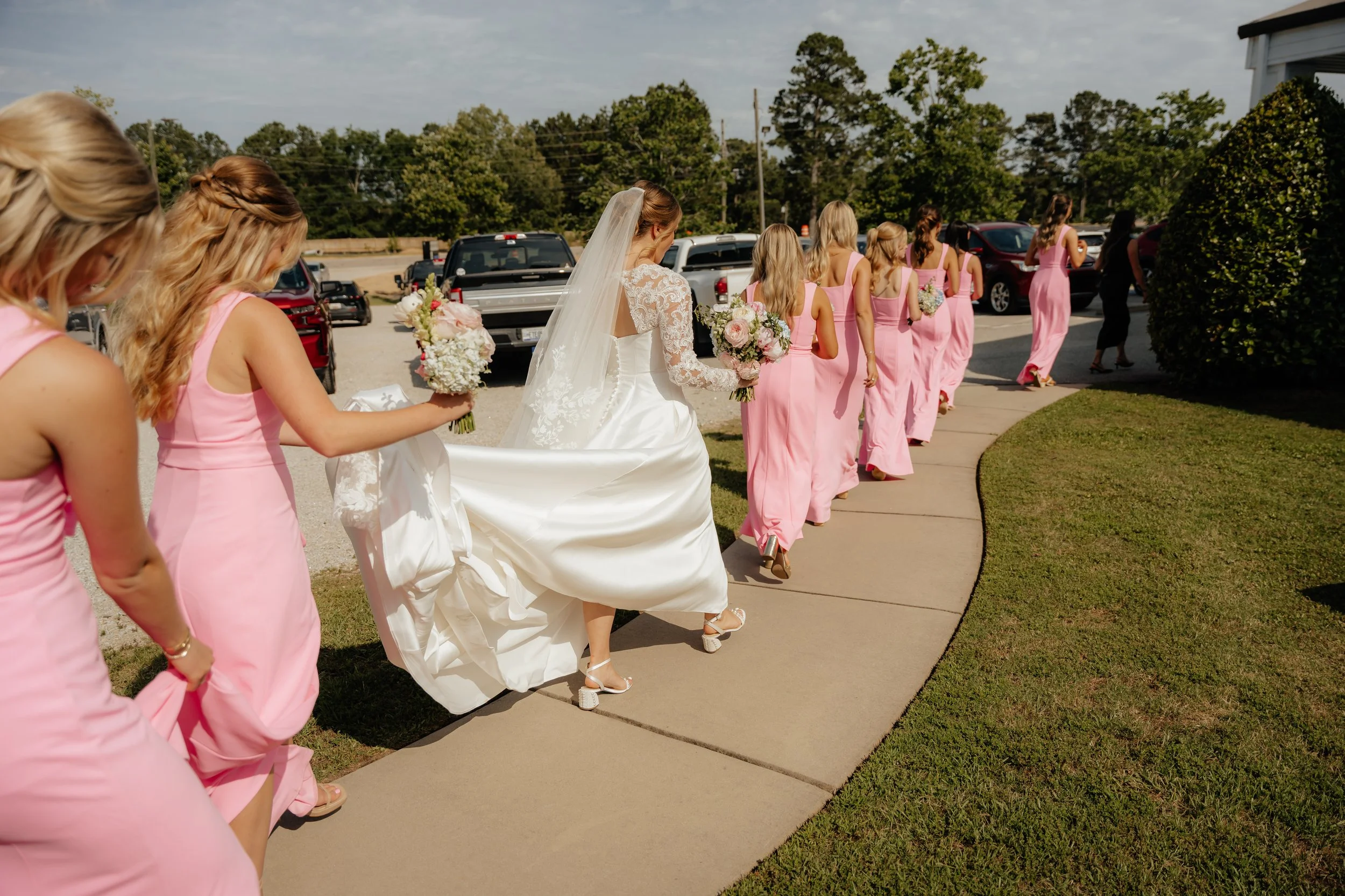 Wedding planner coordinating bride and bridesmaids on wedding day in Augusta Georgia