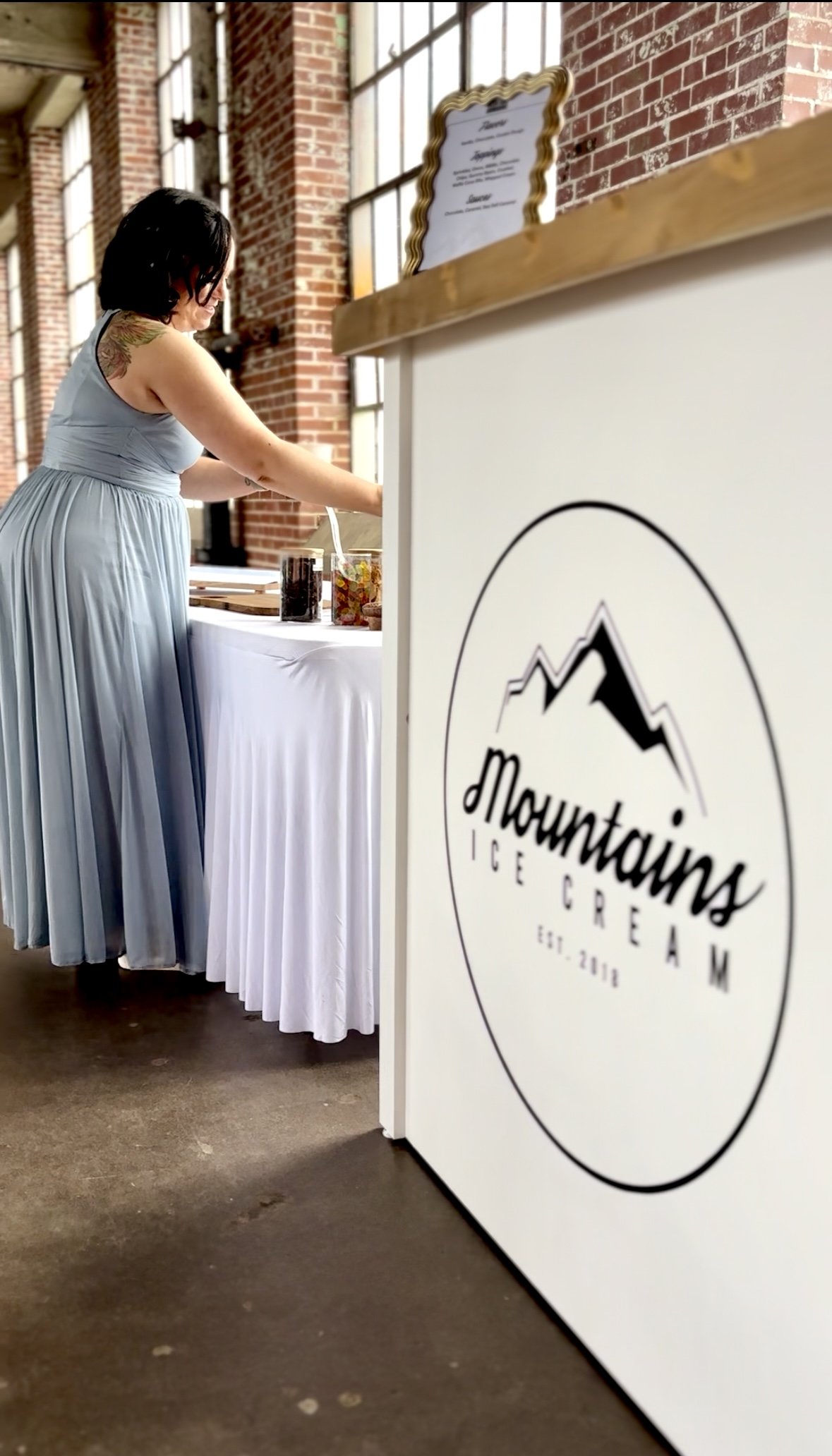 A guest getting ice cream at a wedding from Mountains Ice Cream.