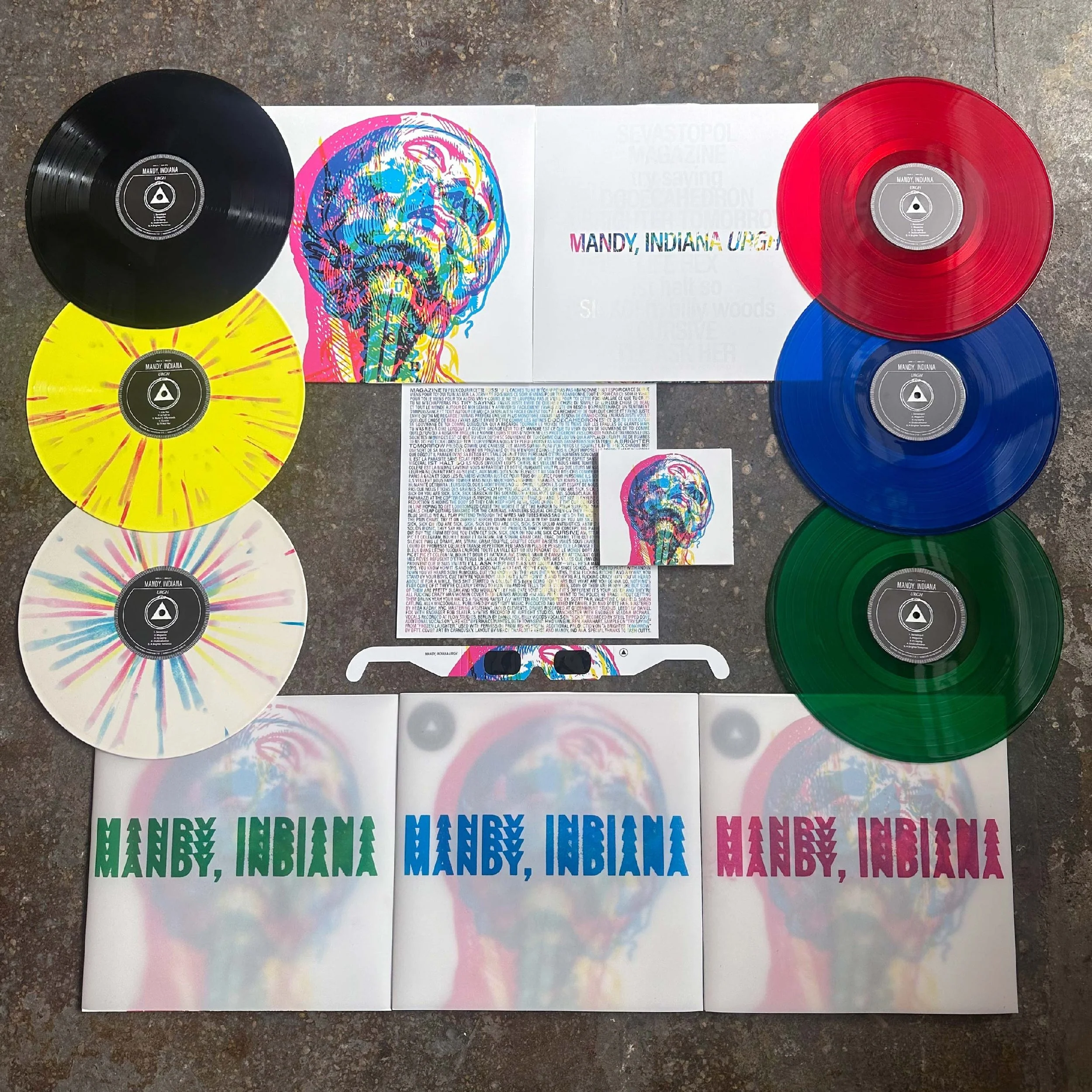 Mandy, Indiana URGH LPs and CD laid out on a concrete floor