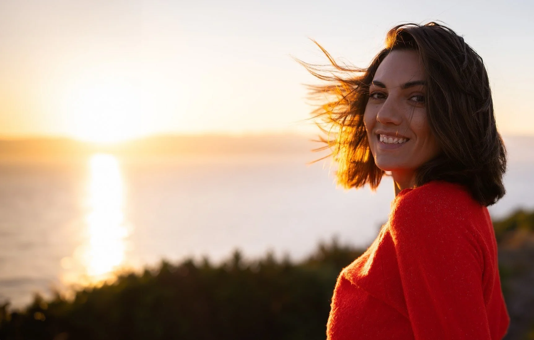 A smiling individual enjoying a moment of peace and clarity after EMDR therapy for clients in Hillsborough and Pasco County.