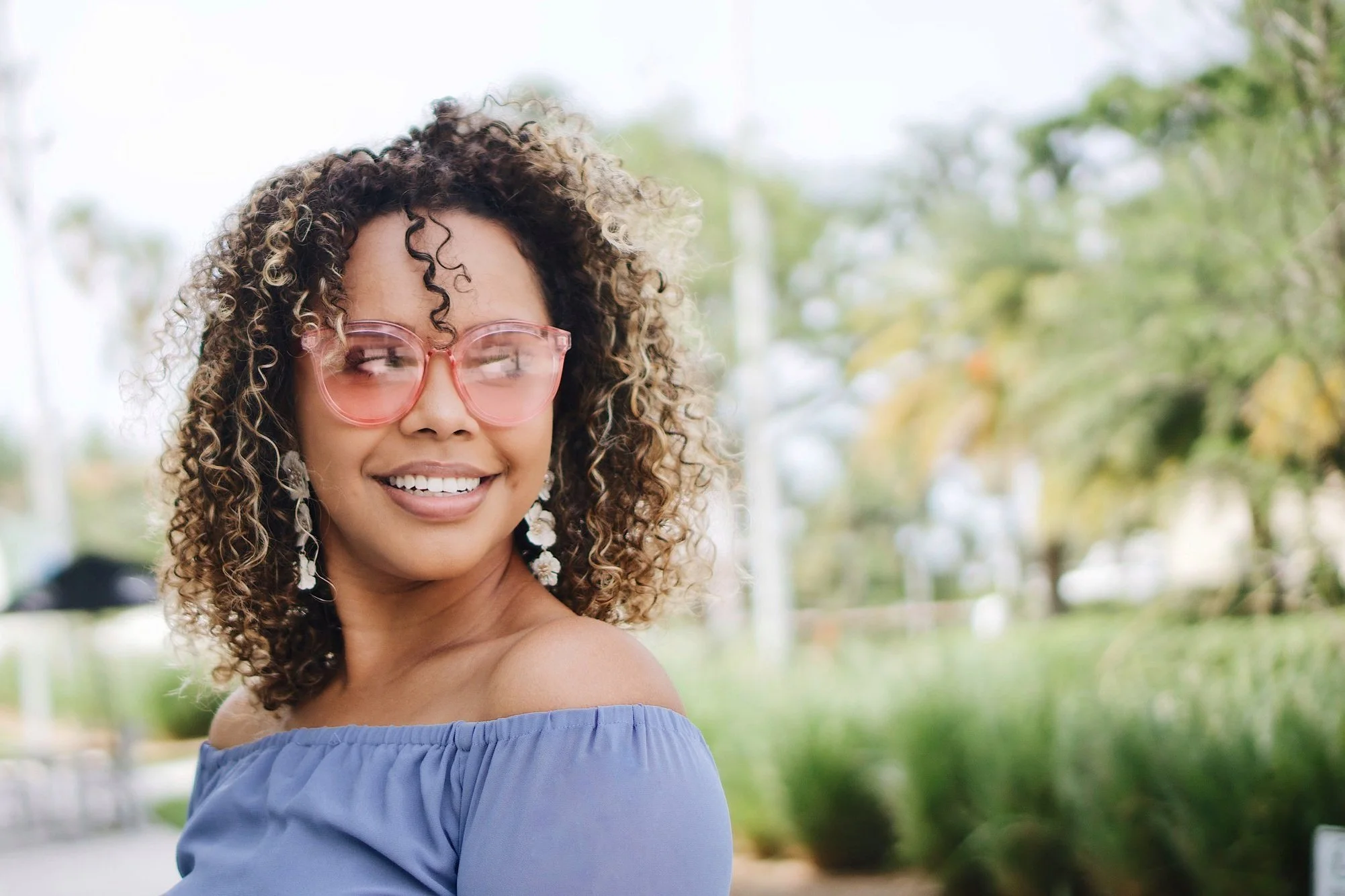 A smiling woman looks confident after finding trauma relief from EMDR therapy intensives in Tampa and New Port Richey.