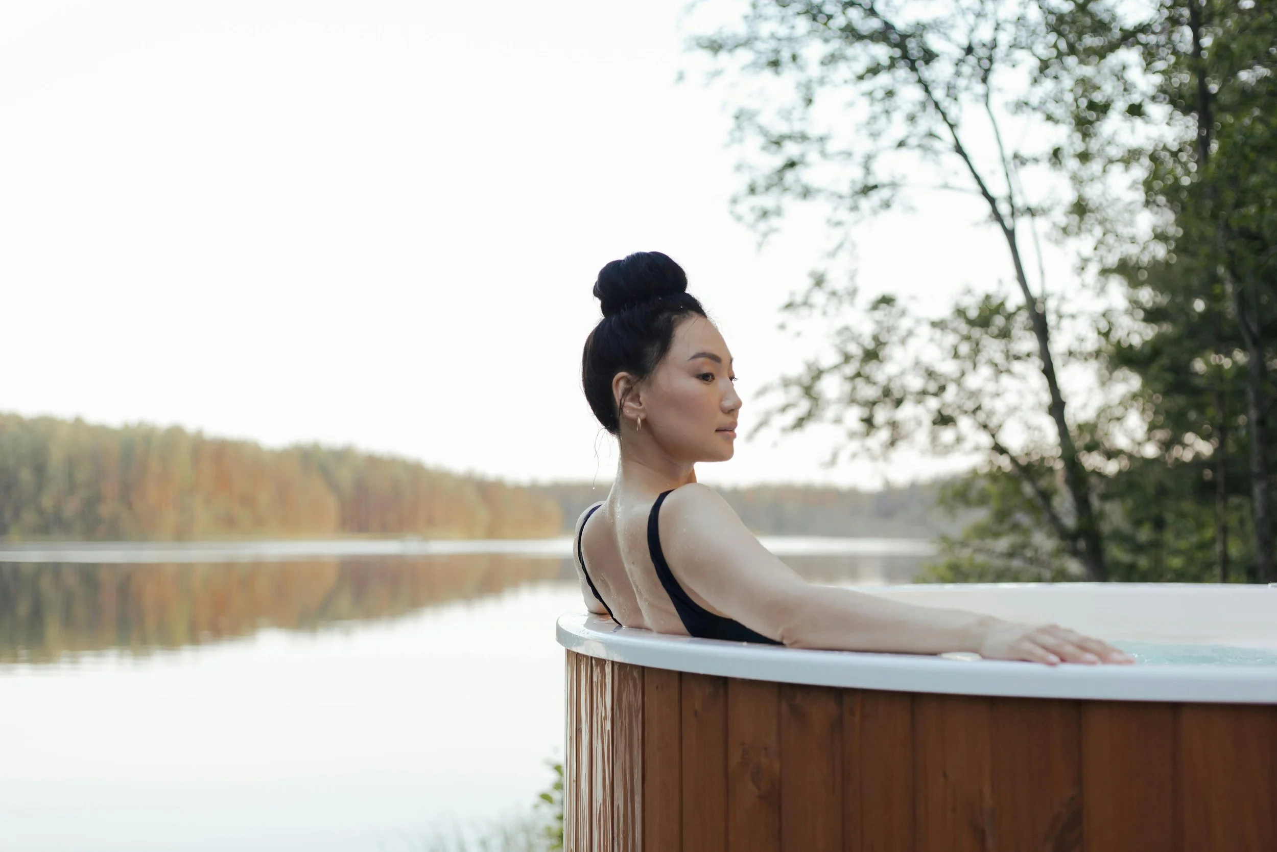Woman in a spa bath in nature