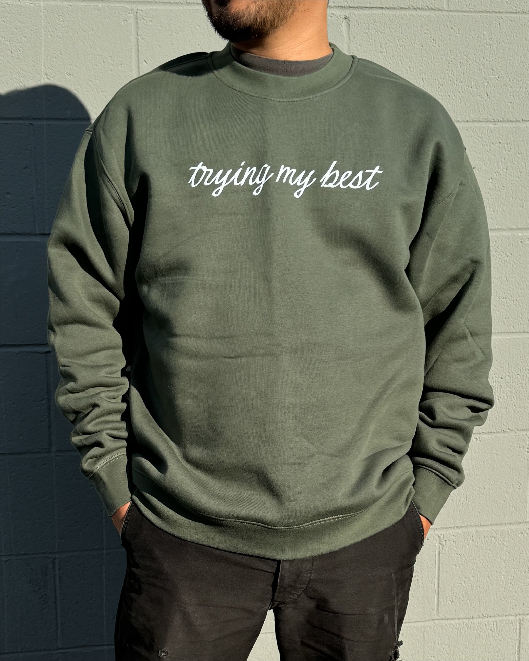 Cypress crewneck on male model with trying my best written in white script