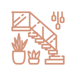 Scenic view of a mountain range with snow-capped peaks, a green hillside in the foreground, and a modern building on the hillside.