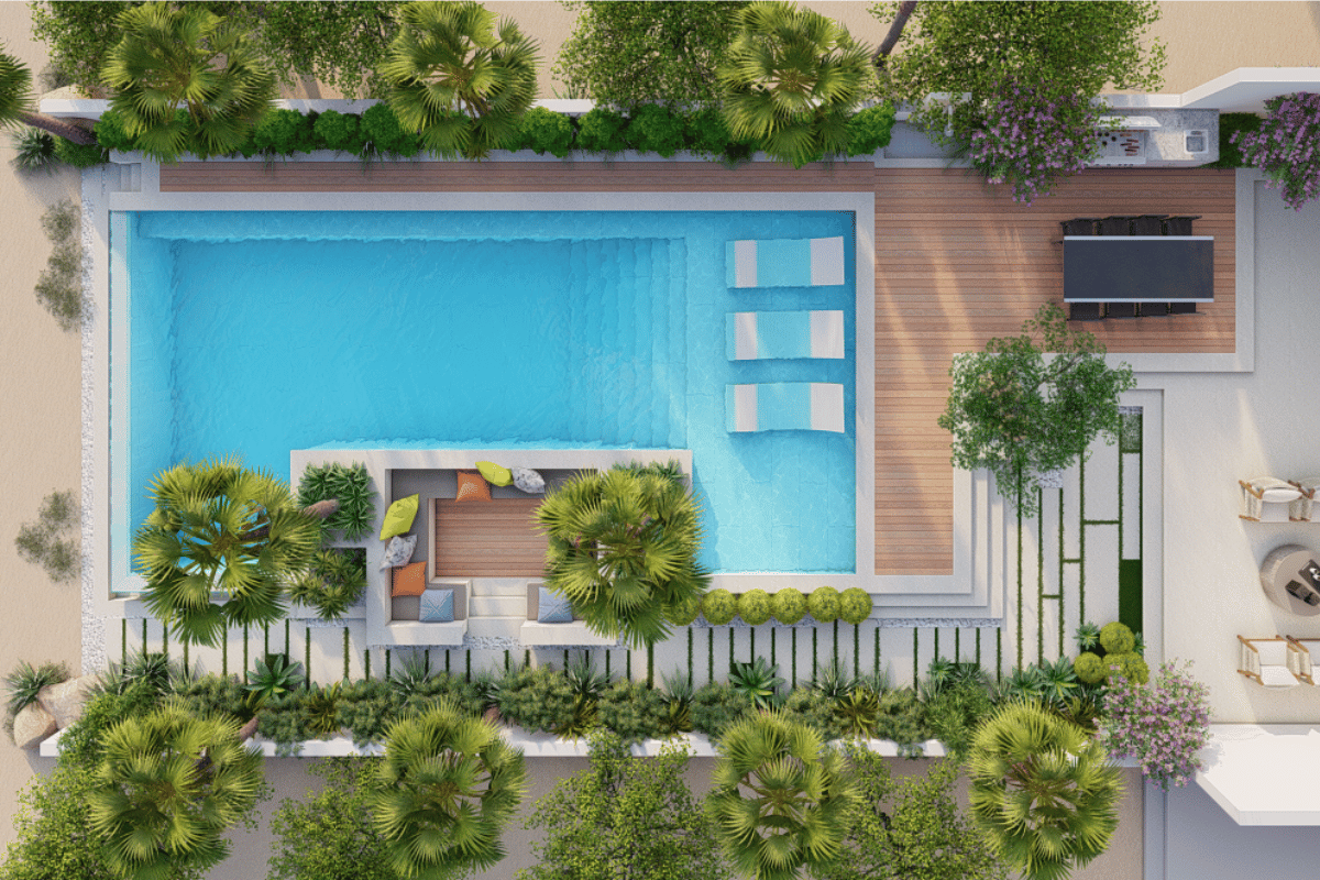 Top-down view of a modern backyard pool area with a rectangular pool, surrounding wooden deck, outdoor seating, and lush green landscaping.