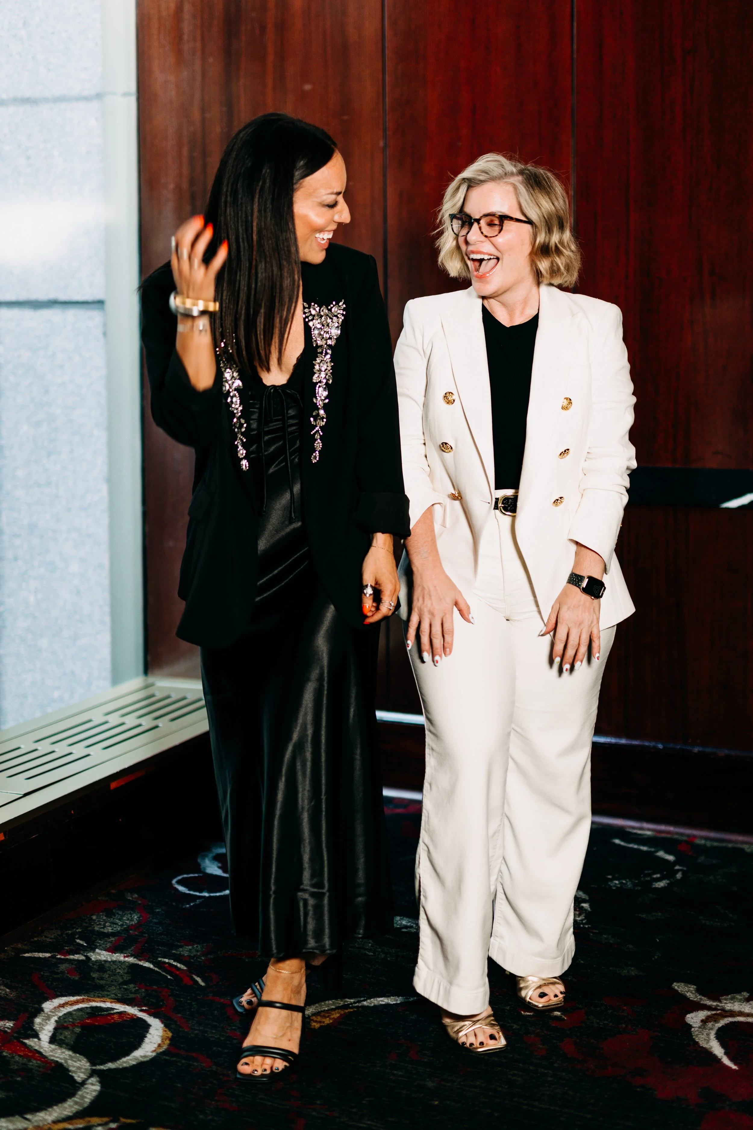 Katie Duke smiling at an event with friend