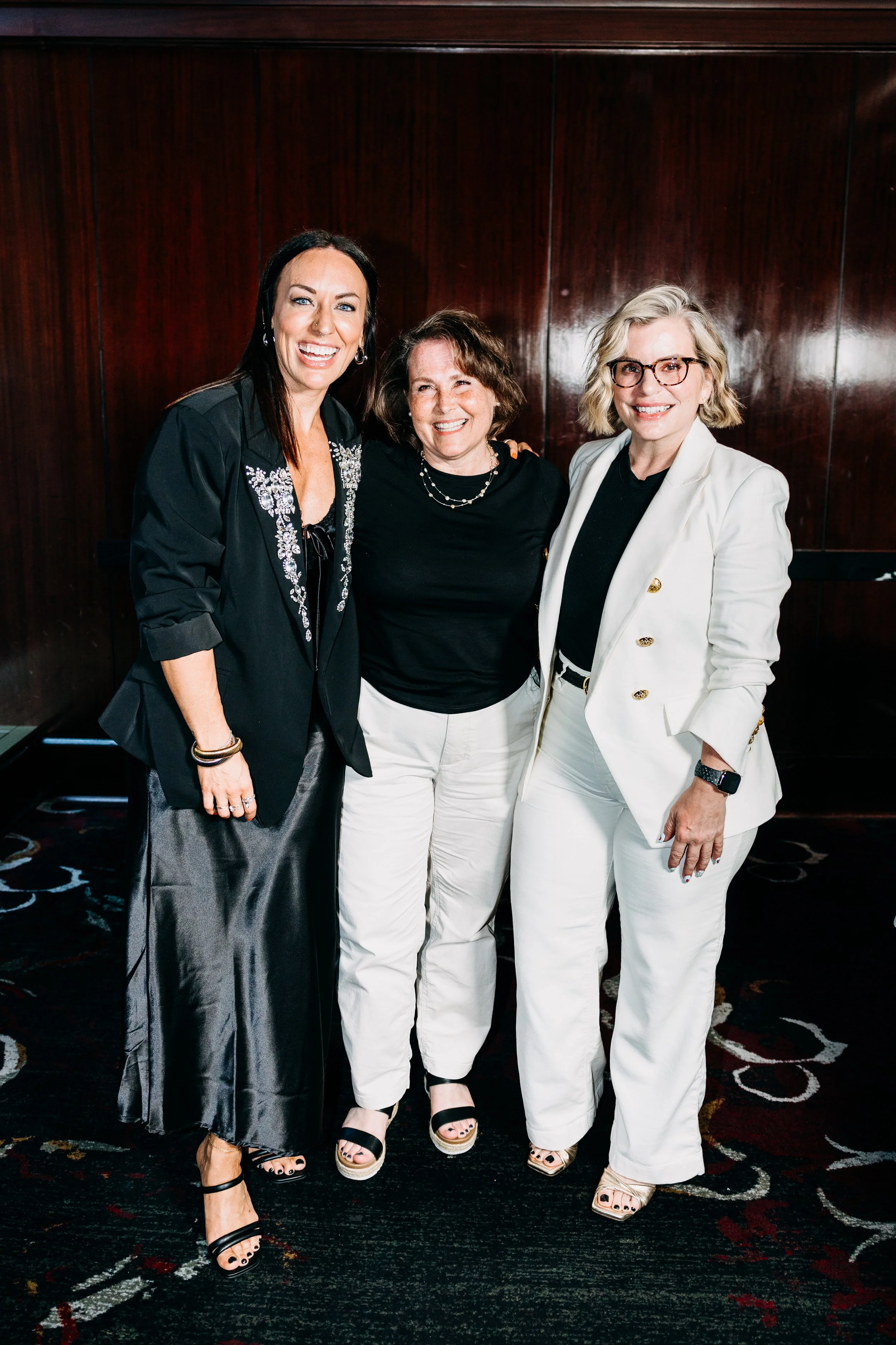 katie duke smiling at an event with friend