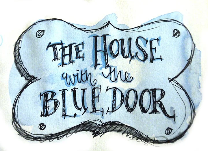 A logo with the text 'The House with the Blue Door'