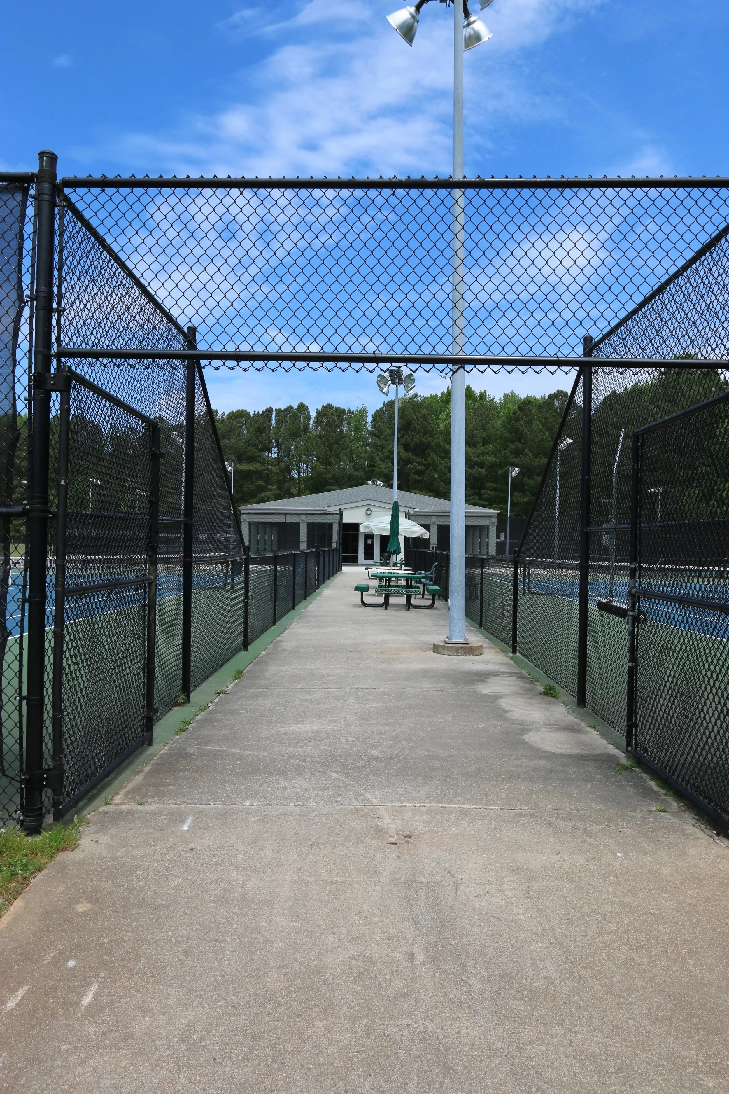  urban-foundry-cobb-county-park-exterior-tennis-court-walkway.jpeg