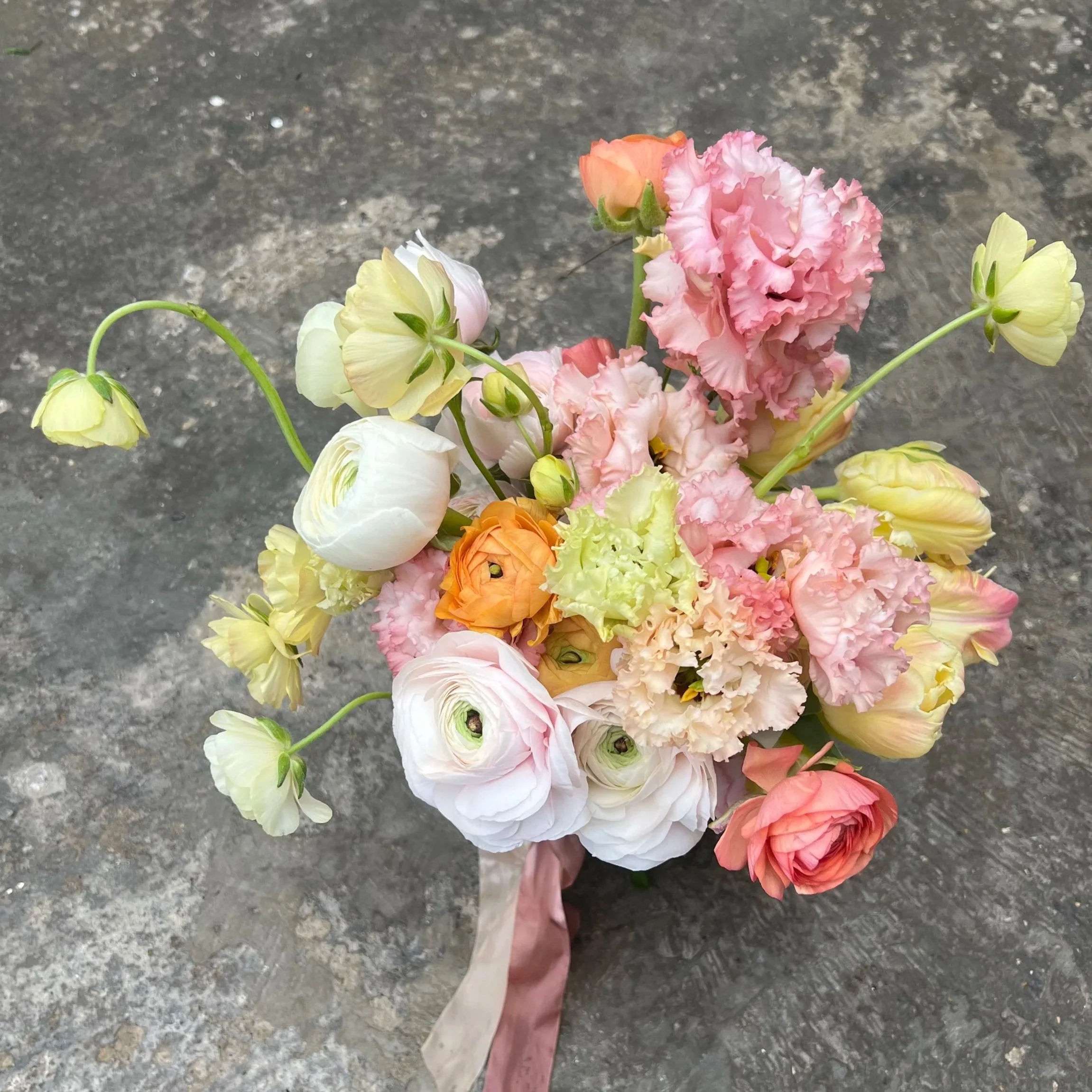 lemon yellow, pink, orange and baby pink spring bridal bouquet
