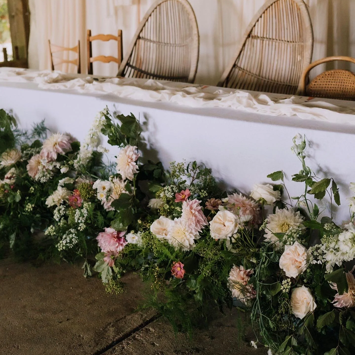 Seasonal summer fresh flower meadow arrangement for a wedding top table