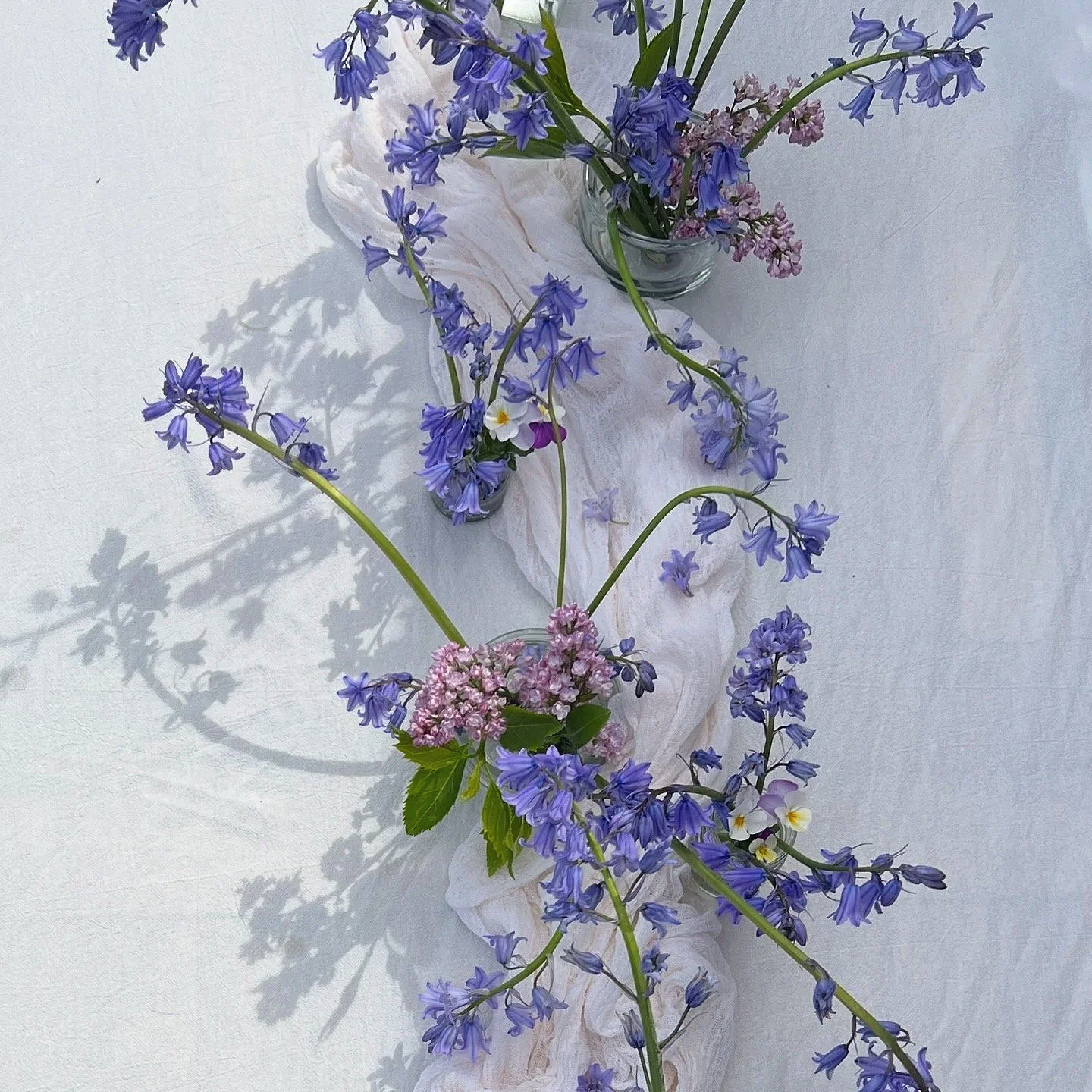 Bluebell, lilac and viola tablescape in spring