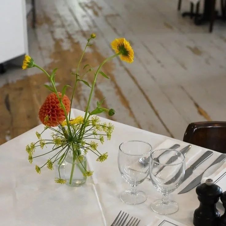 Dahlia bud vase in St John restaurant for a June wedding