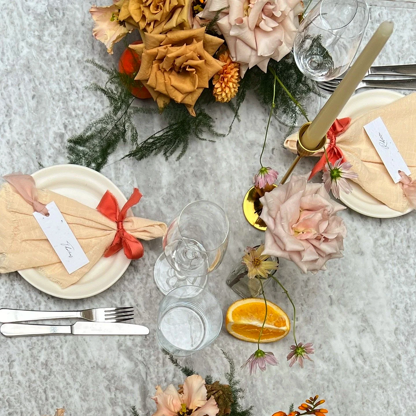 autumn table flowers, candles, ribbons and fruits