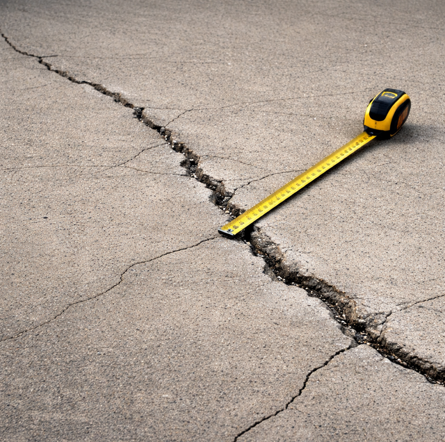 hairline crack run across grey garage floor