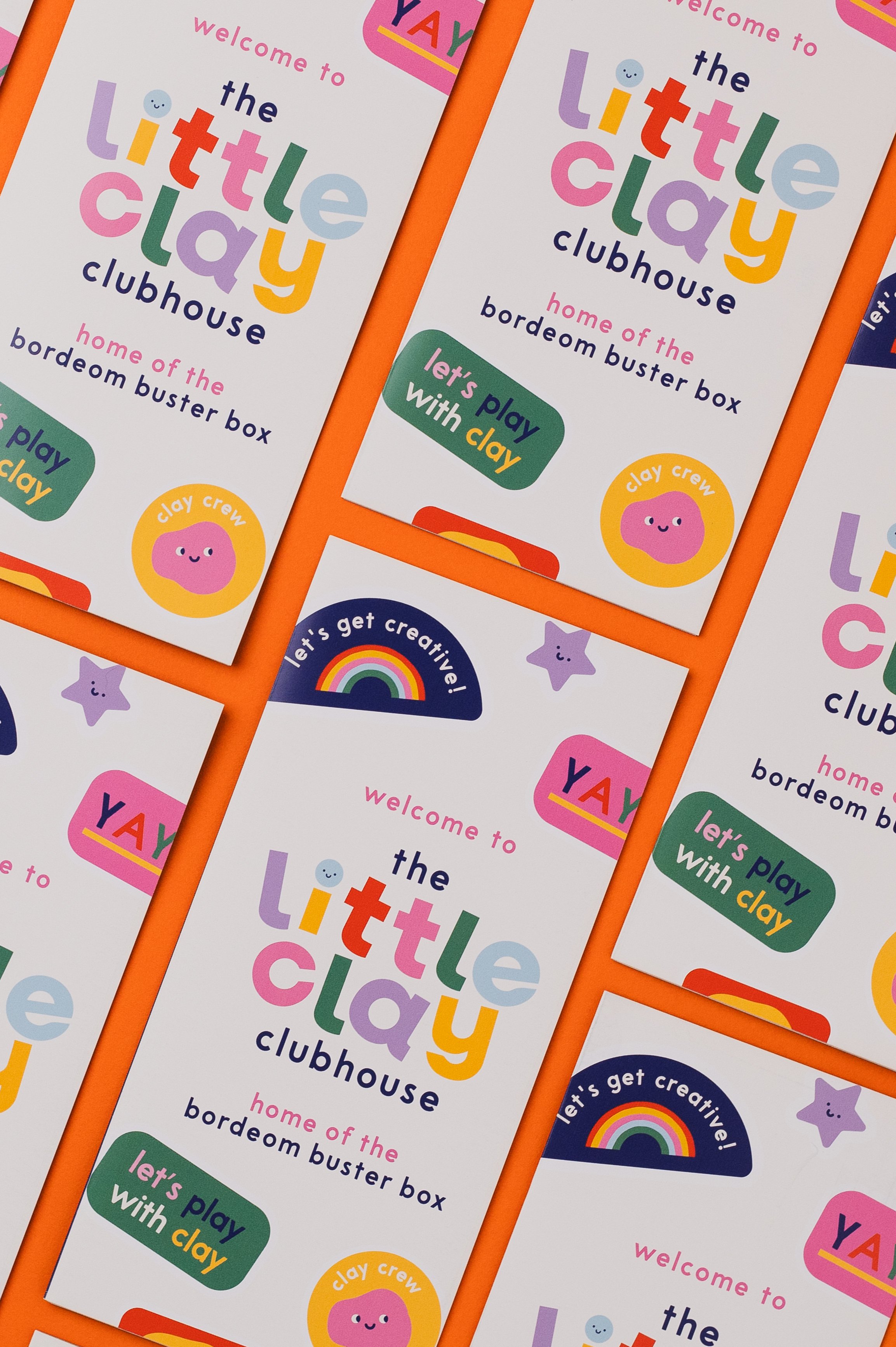 Multiple colorful flyers for a children's club called 'The Little Clay Clubhouse,' featuring playful pastel-colored text, smiley face illustrations, a rainbow graphic, and the phrase 'Let's play with clay.'