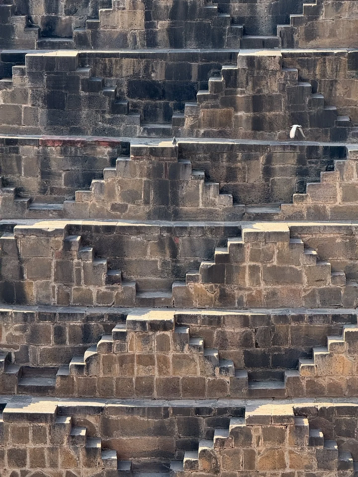Chand Baori is a stepwell situated in the village of Abhaneri in the Indian state of Rajasthan.[1][2][3] It extends approximately 30 m (100 ft) into the ground, making it one of the deepest and largest stepwells in India.[4] It is named after a local