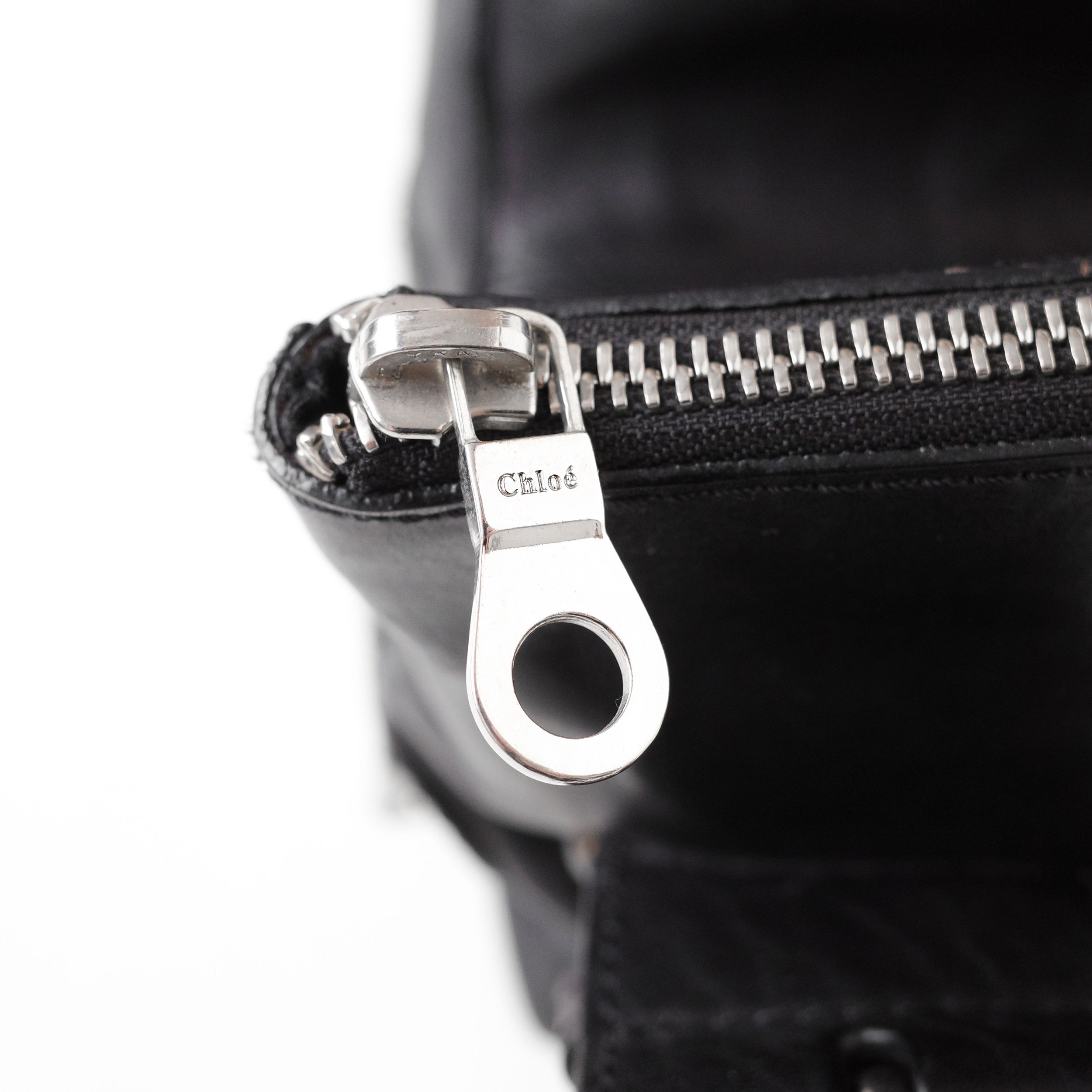 Chloé FW 2003 Phoebe Philo era mini camera bag in thick grained leather with a double chain strap and multiple zip compartments. Available at Artefact Archive.