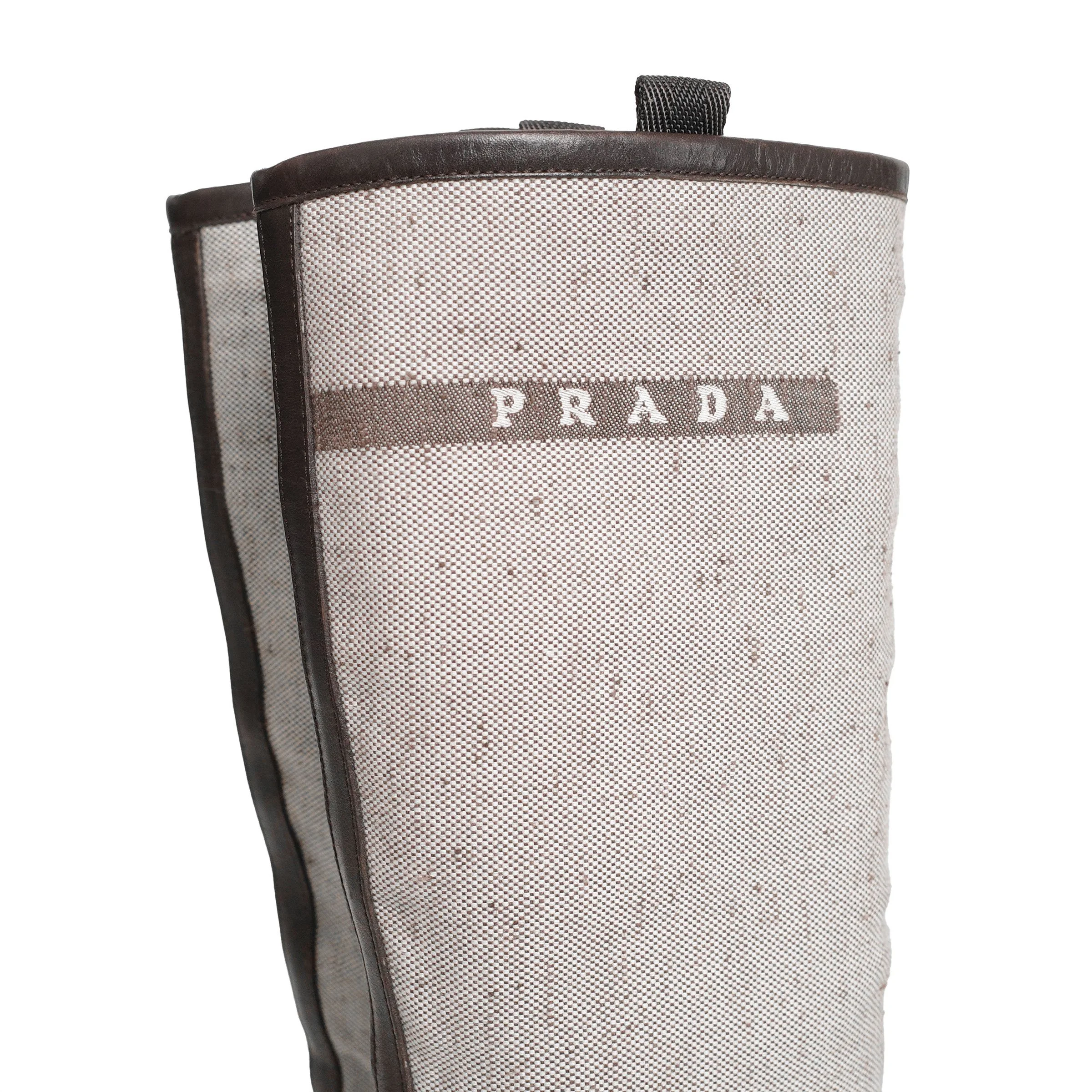 Prada SS 1999 split sole knee boots composed of canvas and leather. Size EU 37 / UK 4. Available at Artefact Archive.