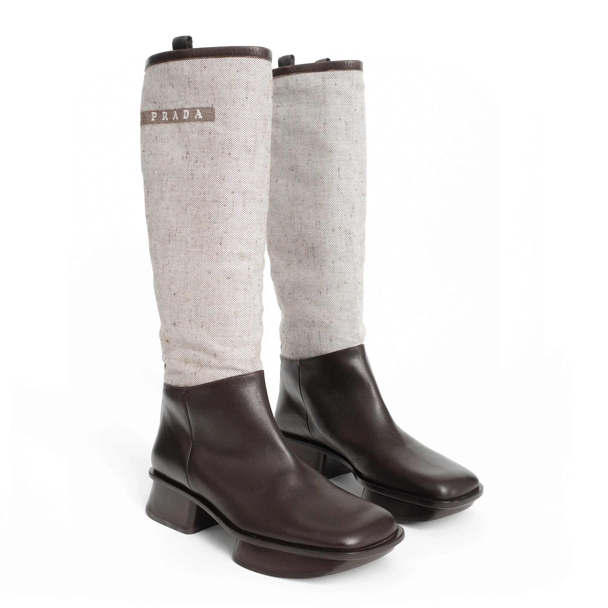 Prada SS 1999 split sole knee boots composed of canvas and leather. Size EU 37 / UK 4. Available at Artefact Archive.