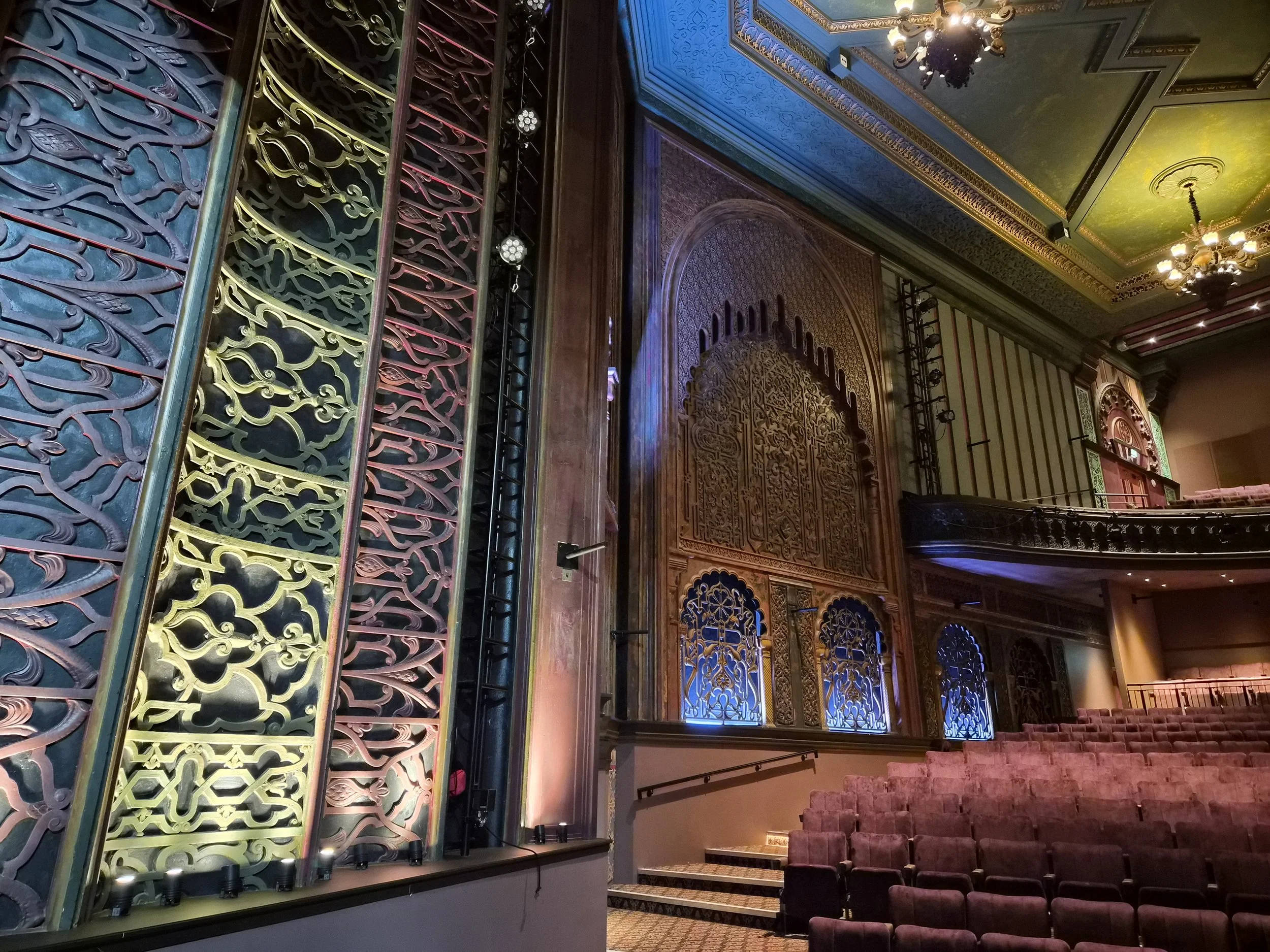 Ornate patterned walls, ceiling chandeliers and rows of mauve seats inside Soho Theatre Walthamstow, photographed in January 2026.