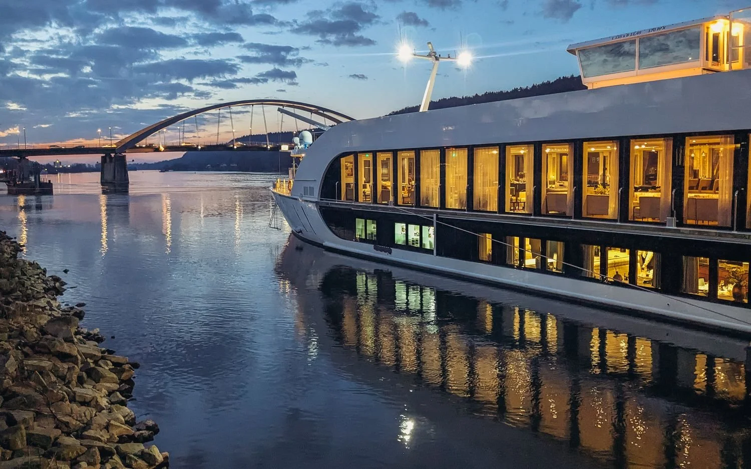 River cruise ship docked at blue hour