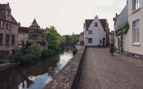 Cyclist on cobblestones, Bruges