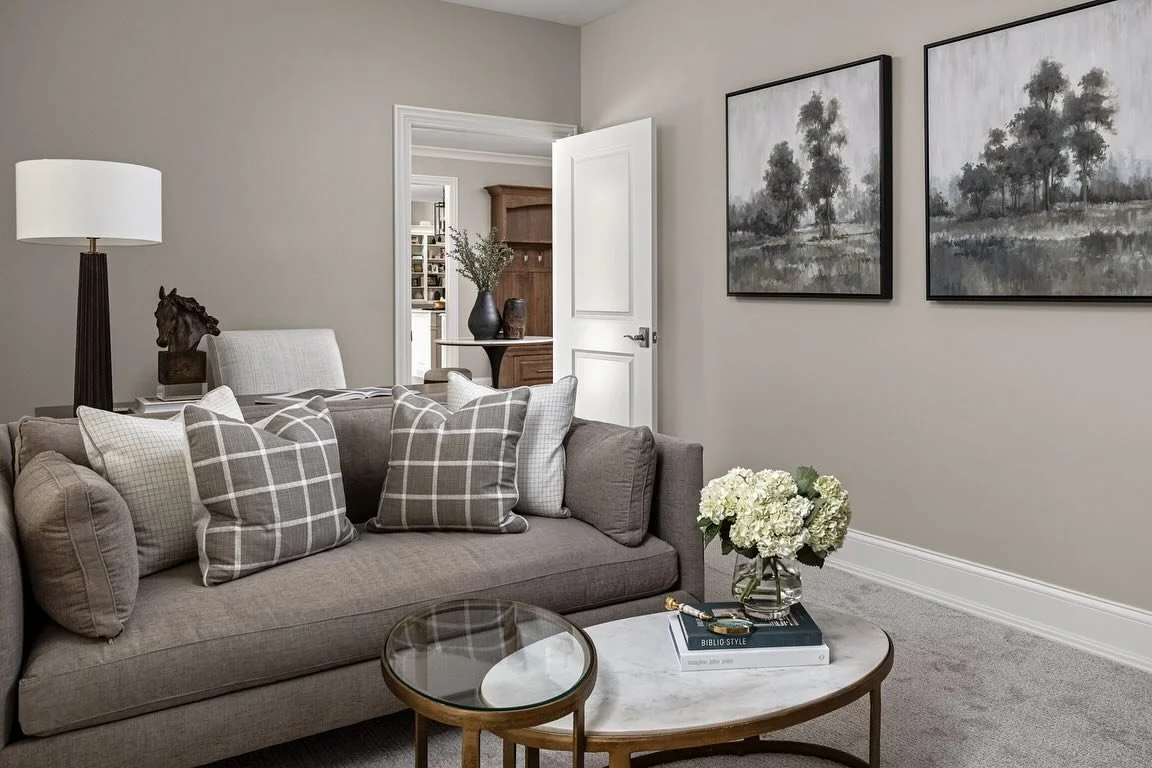 An office where work from home can end with a happy hour! This warm and inviting home office is draped in custom details from the window treatments to furnishings and decor. Our design team was able to make this multi-functional space a place our cli