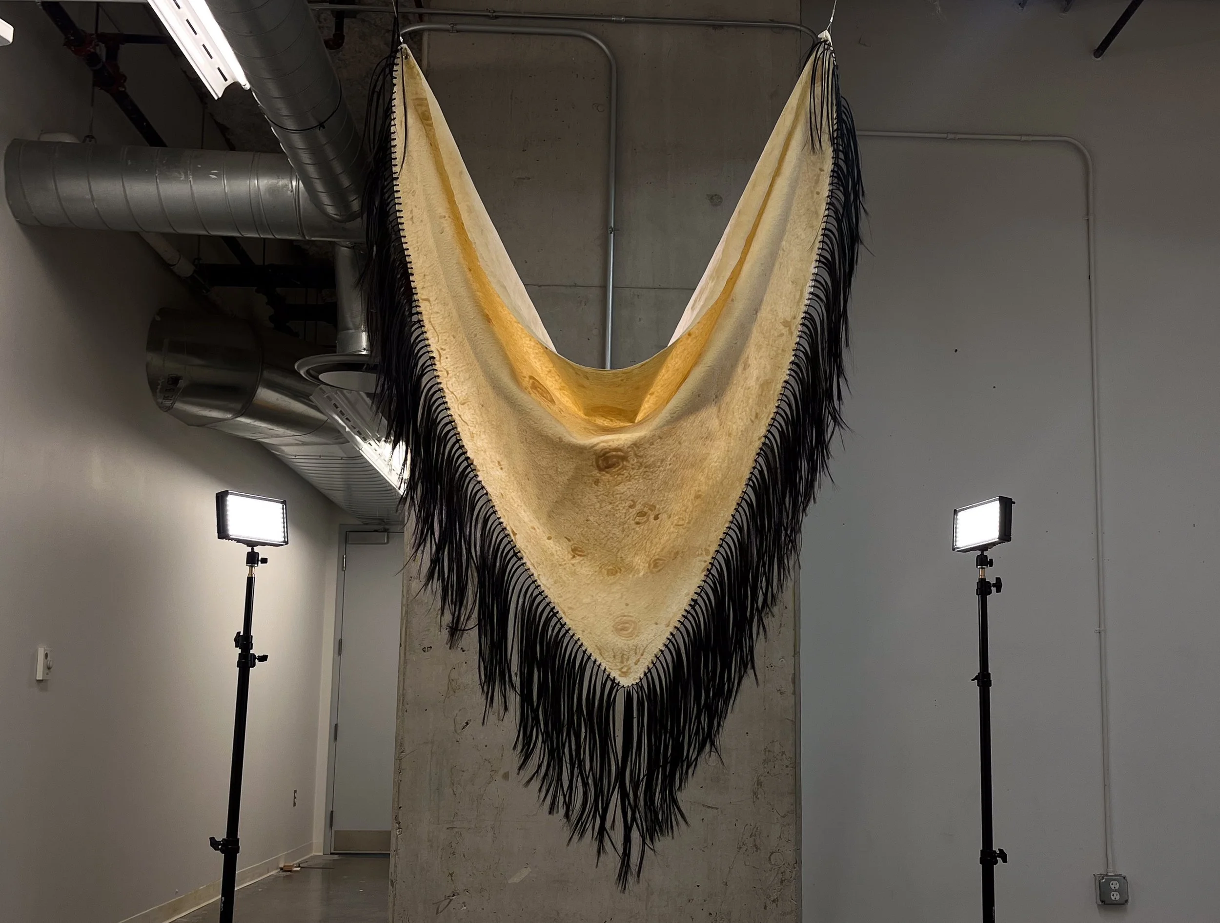 Manton de 
Latex and synthetic hair, 6 X 3.5 feet, 2025  
