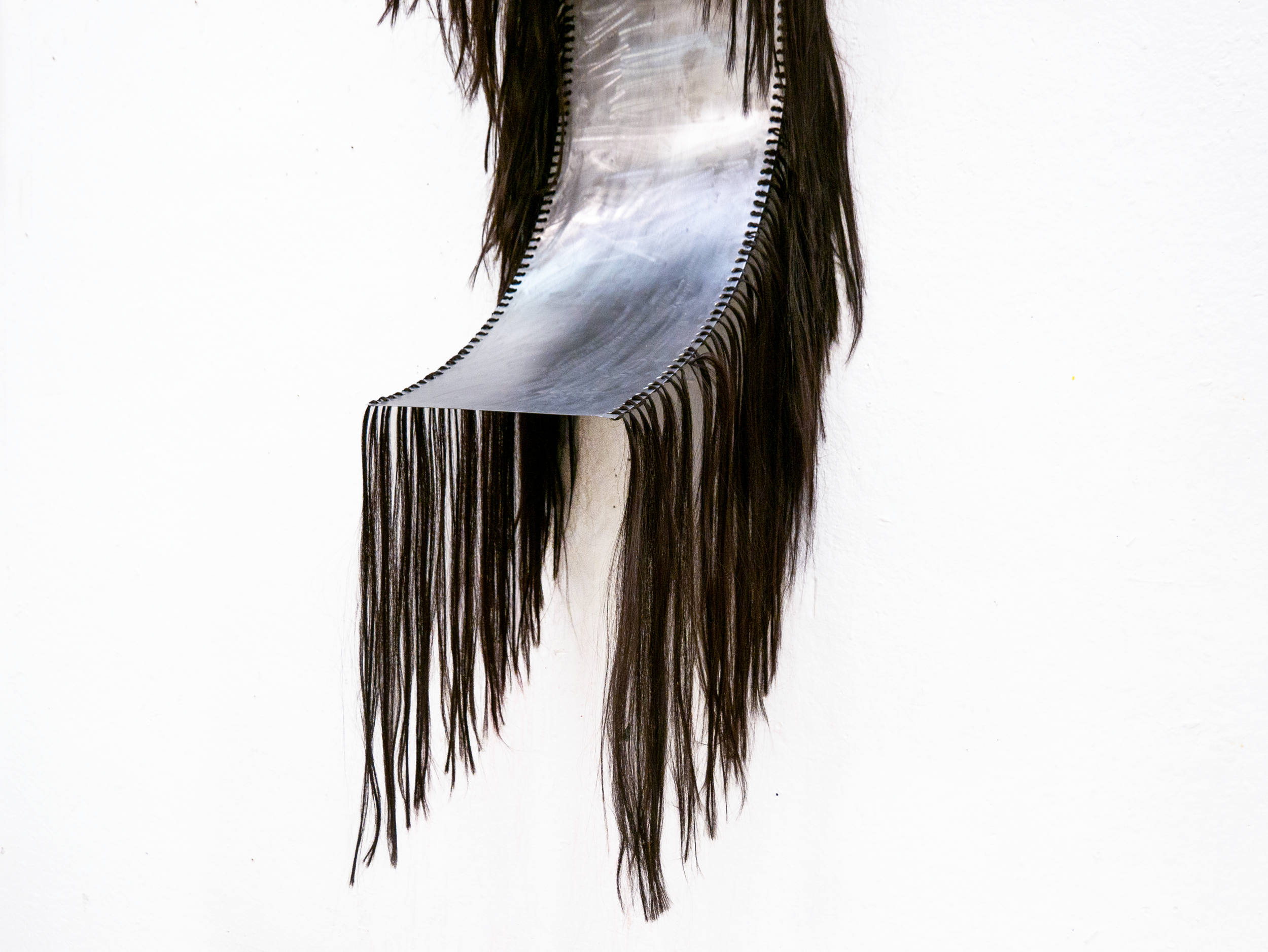 FIGURE #2 
Steel and synthetic hair.
4 x 1-foot steel sheets. 