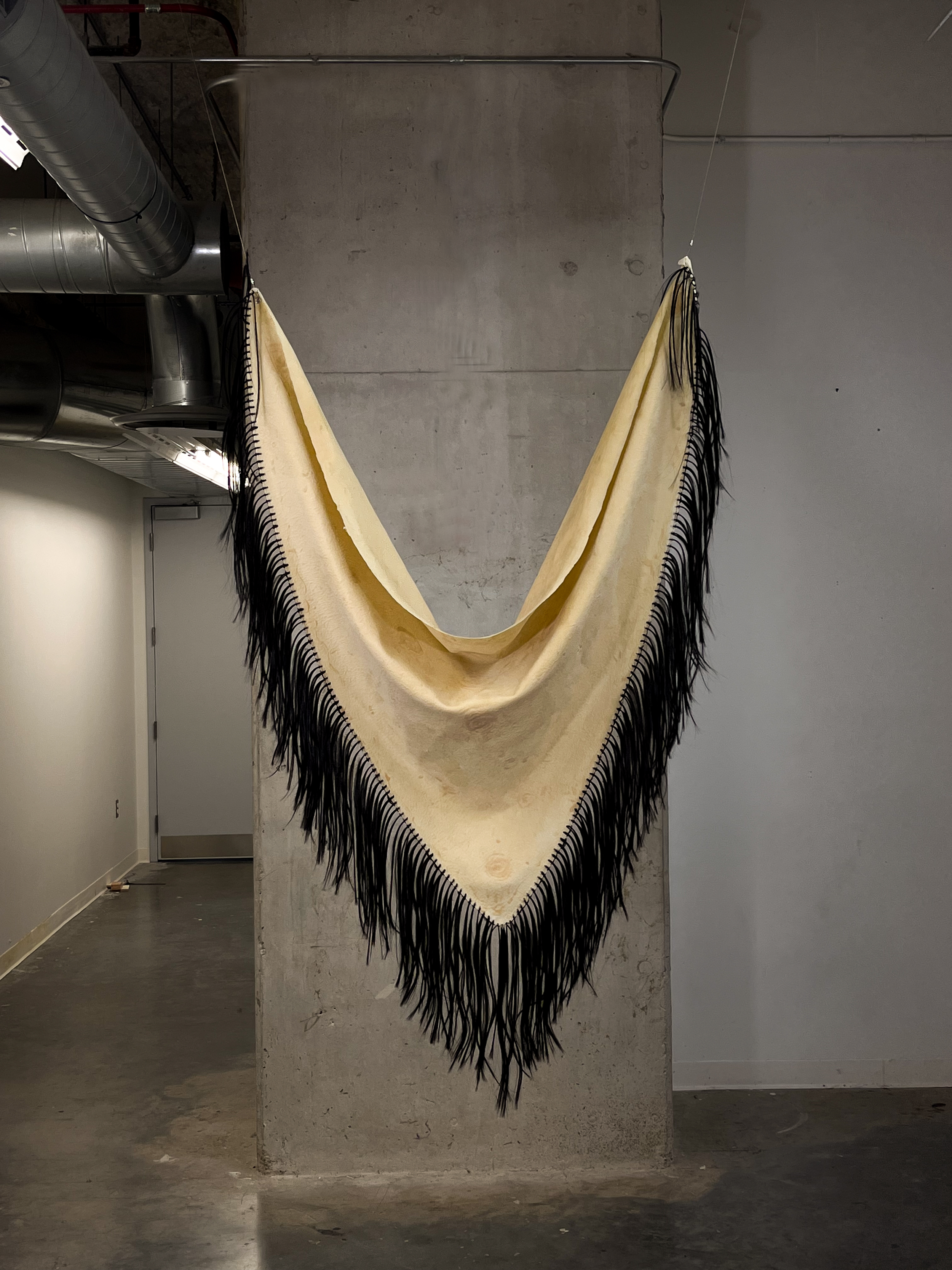 Manton de 
Latex and synthetic hair, 6 X 3.5 feet, 2025  