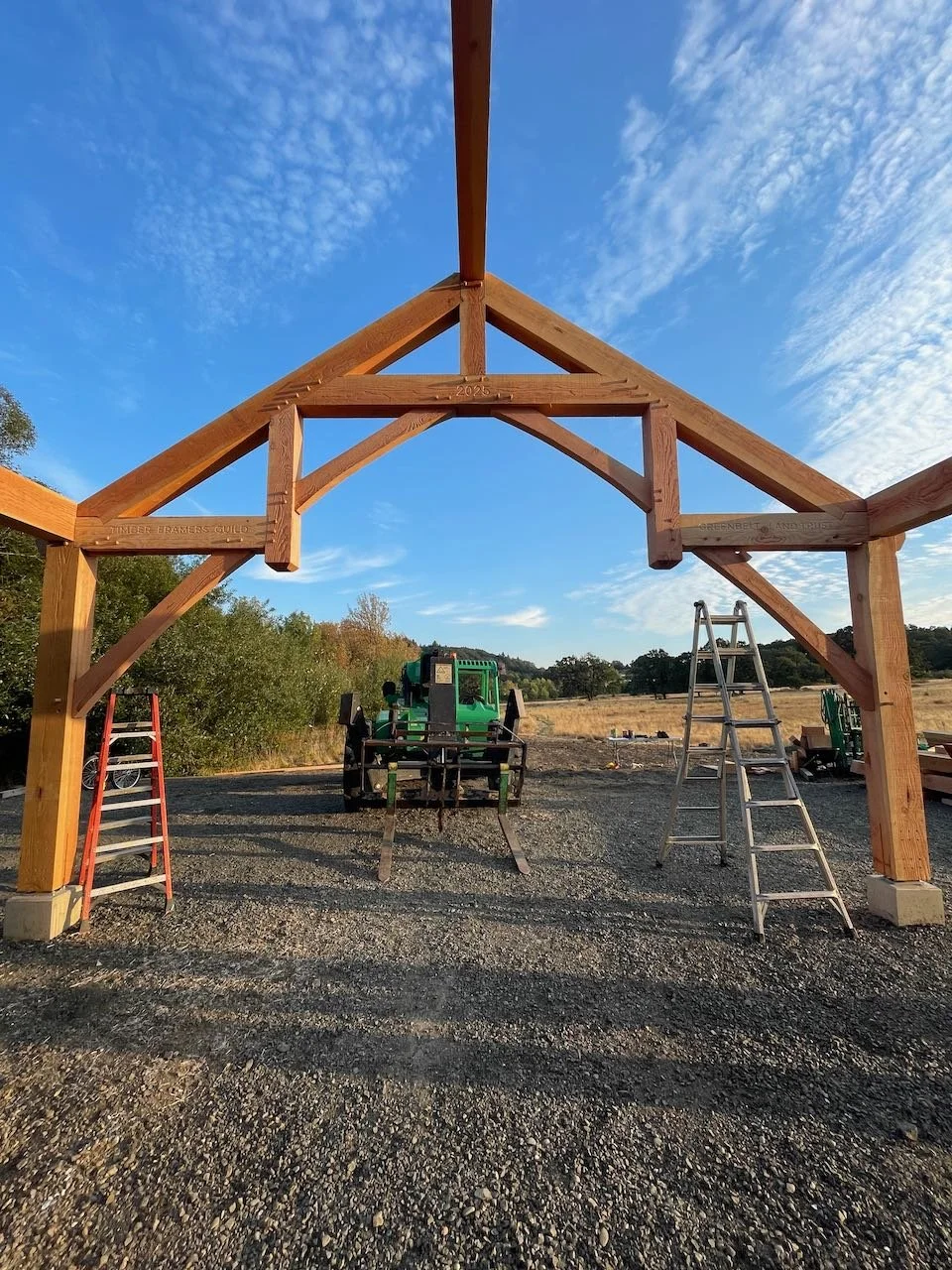 Hammer beam truss against a blue sky