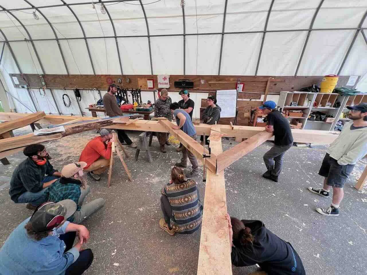 Workshop students learn to scribe with straight and curvy timber