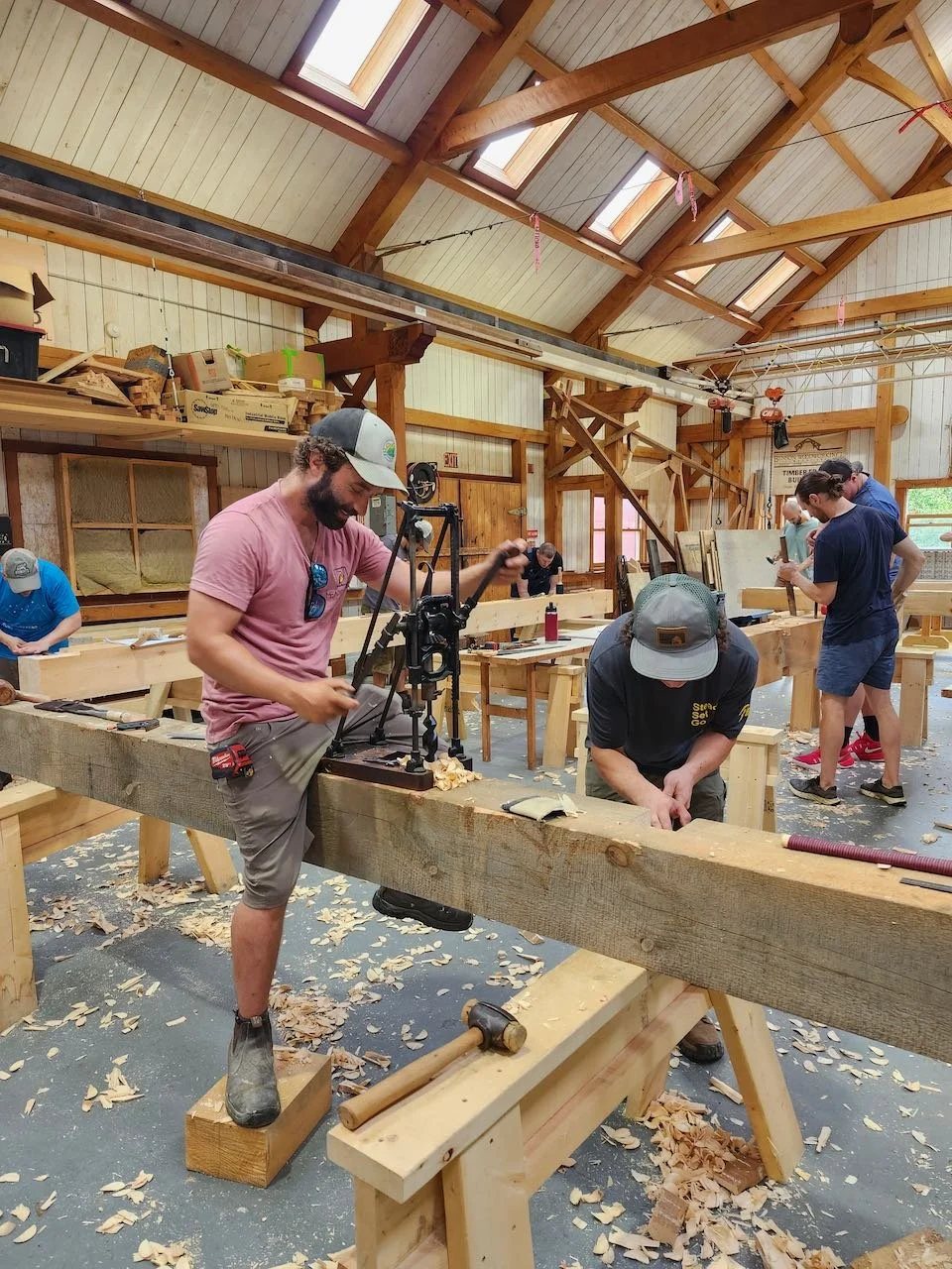 Students learning to cut joinery with antique tools