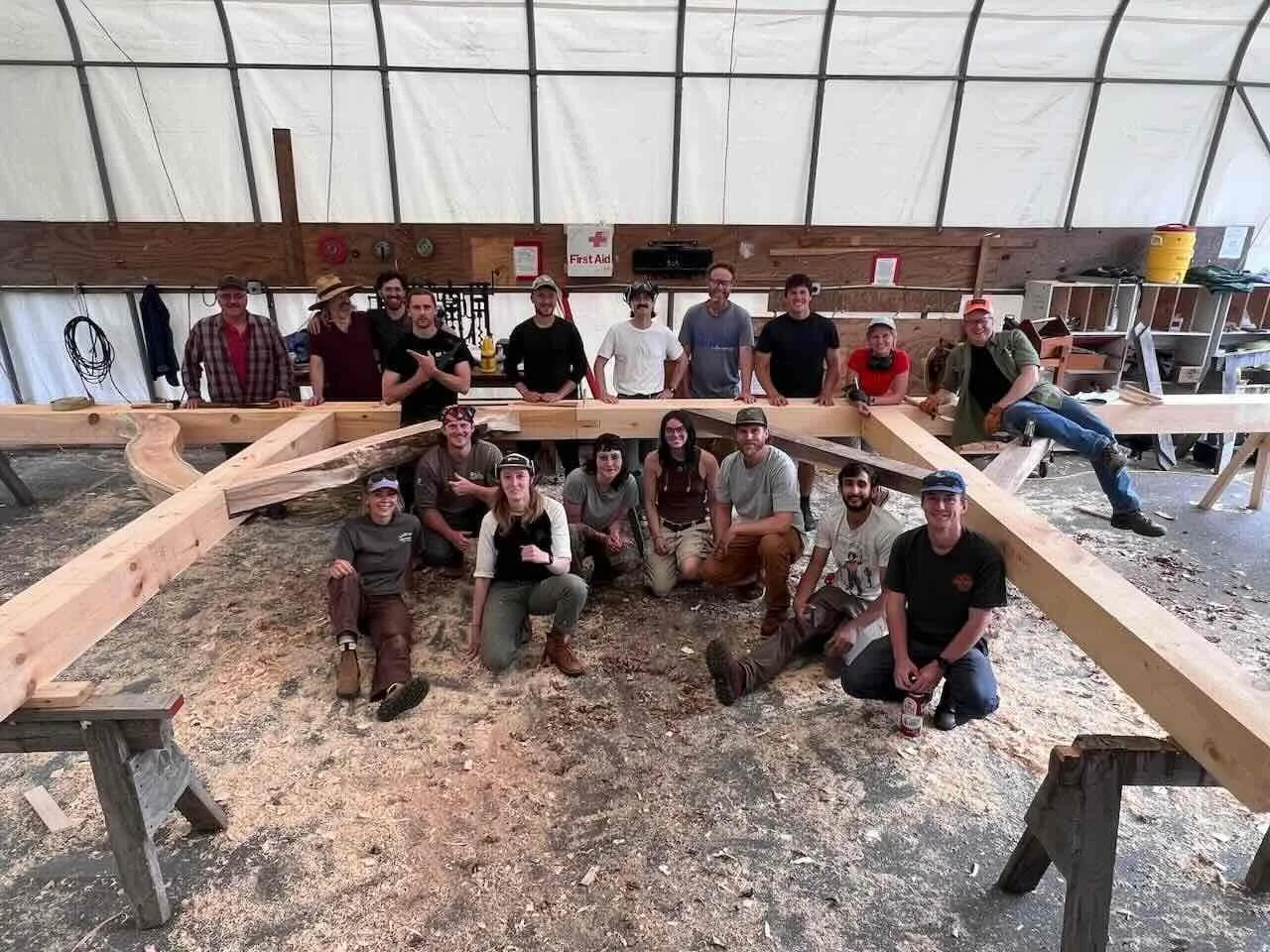 Class photo of completed scribed timber assembly