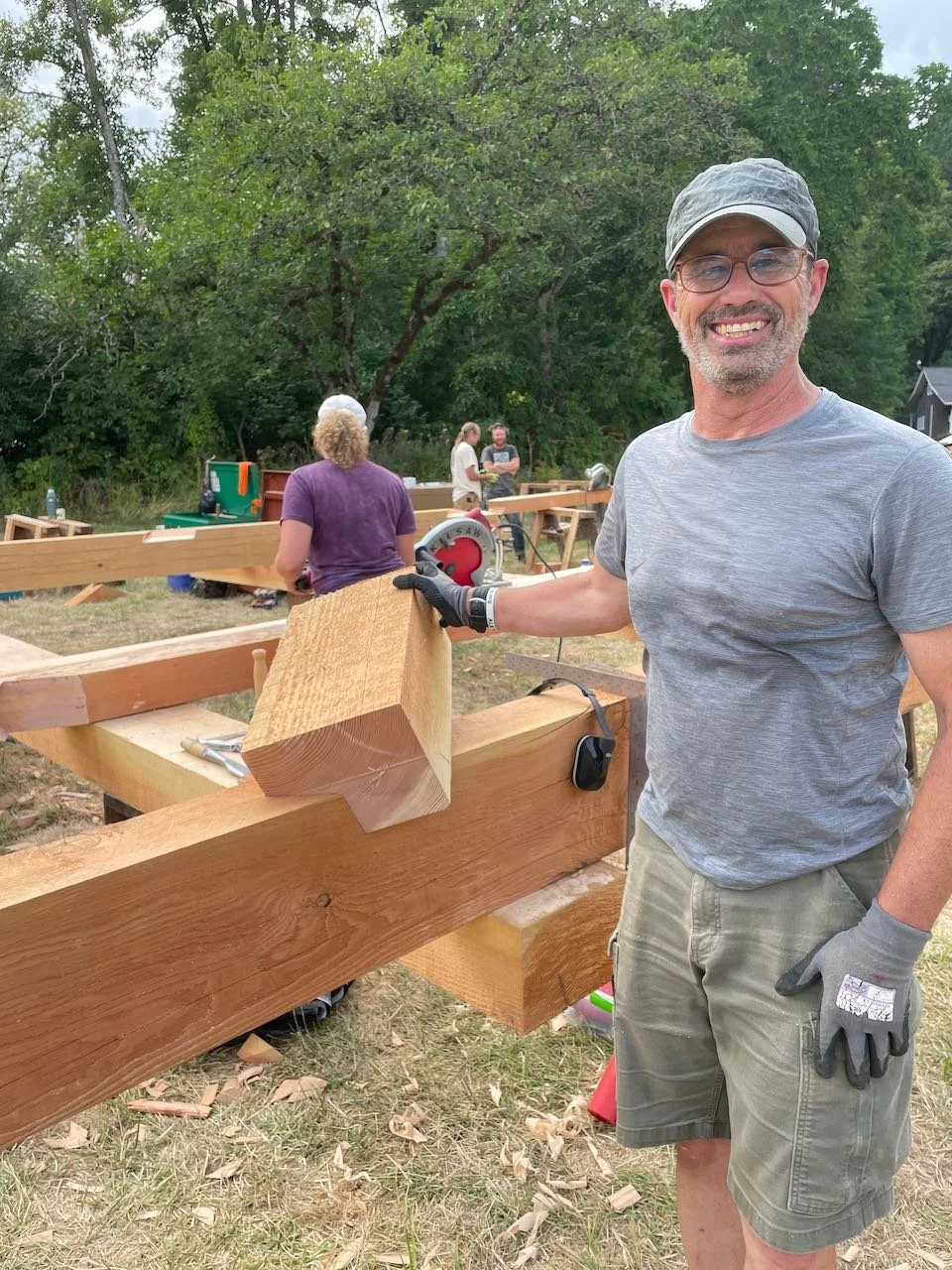 Proud carpentry student test fitting a joint
