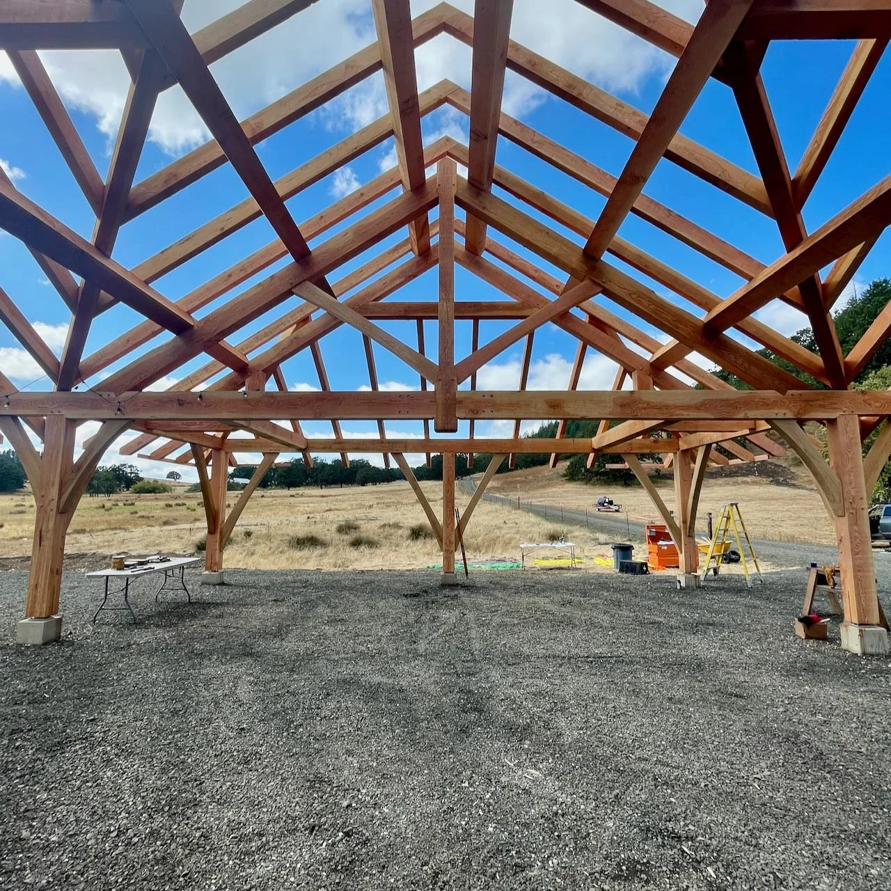 King post trusses and valley rafters against blue sky