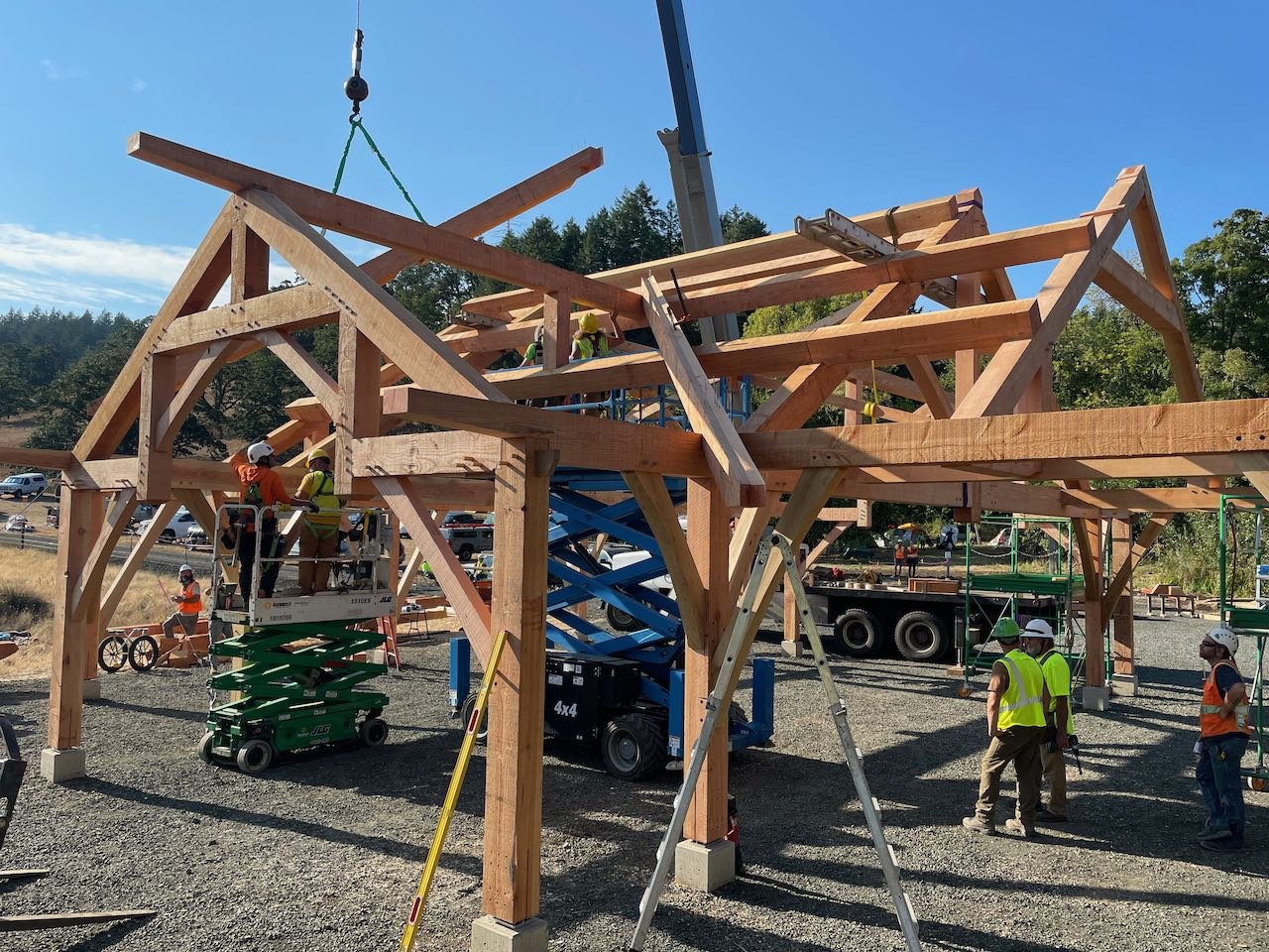 Crane assembling a hip and valley roof system