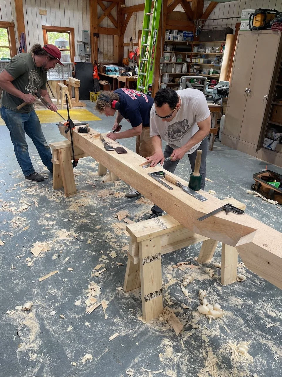 Students cutting a hip rafter