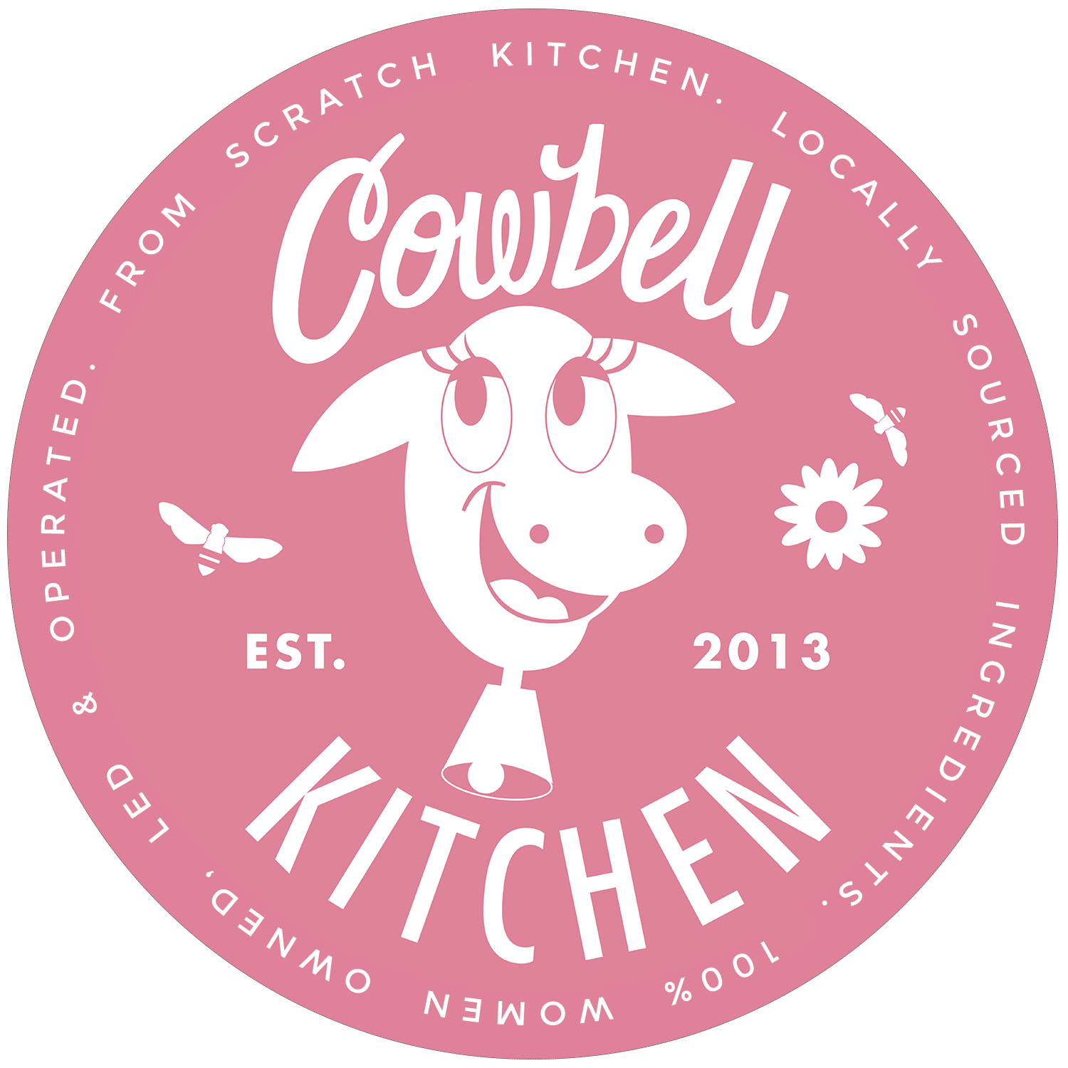A pink circular logo for Cowbell Kitchen featuring a cartoon cow with a happy expression, surrounded by butterflies and a flower. Text around the circle reads 'From Scratch Kitchen. Locally Sourced. Incredibly Delicious. Est. 2013. Welcome to Cowbell Kitchen.'