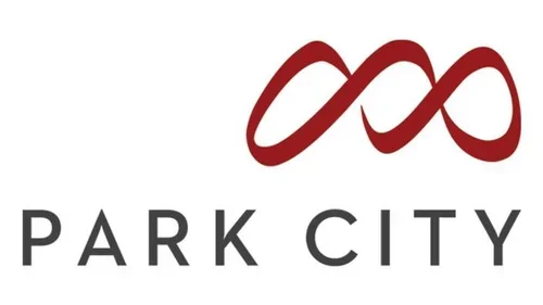 Logo for Park City featuring an infinity symbol in red and the words 'PARK CITY' below in black.