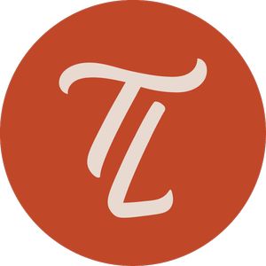 A circular orange logo with white stylized letters 'T' & 'L' in the center.