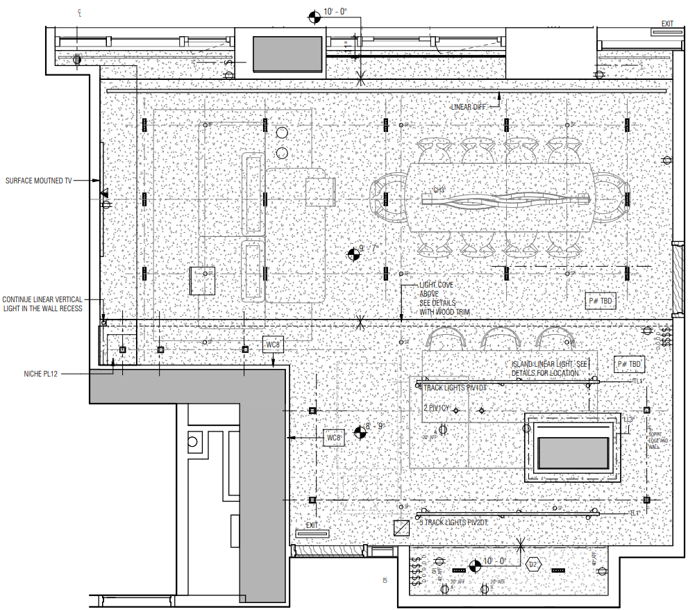A detailed architectural floor plan of a large open-concept room with a conference table, chairs, a surface-mounted TV, a bar or kitchen area, water closets, lighting fixtures, and various annotations for construction and design elements.