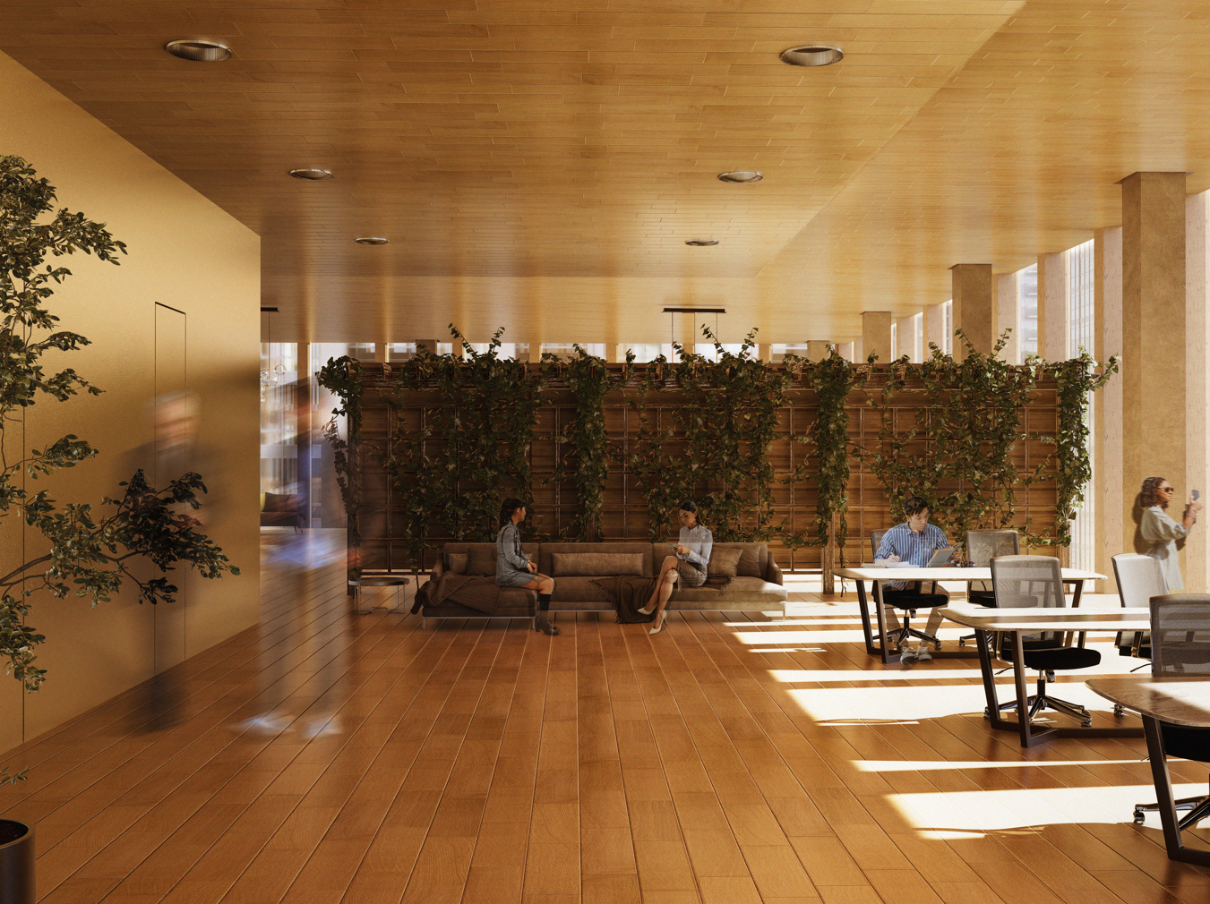 An office lounge area with two women sitting on a sofa, a man working at a desk, and a woman taking a photo, with wooden floors, a wooden ceiling, and tall windows letting in natural light, decorated with green plants and a wooden partition covered in vine.