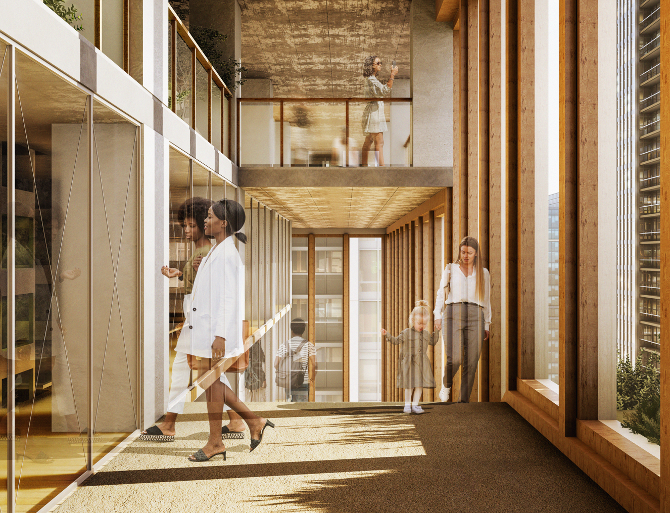 Interior view of a modern office building with glass walls and wooden accents, featuring people walking and a woman taking a photo on the upper floor.
