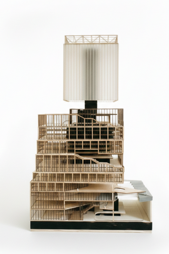A detailed architectural model of a modern building with multiple levels, open spaces, staircases, and a large rectangular structure on top.