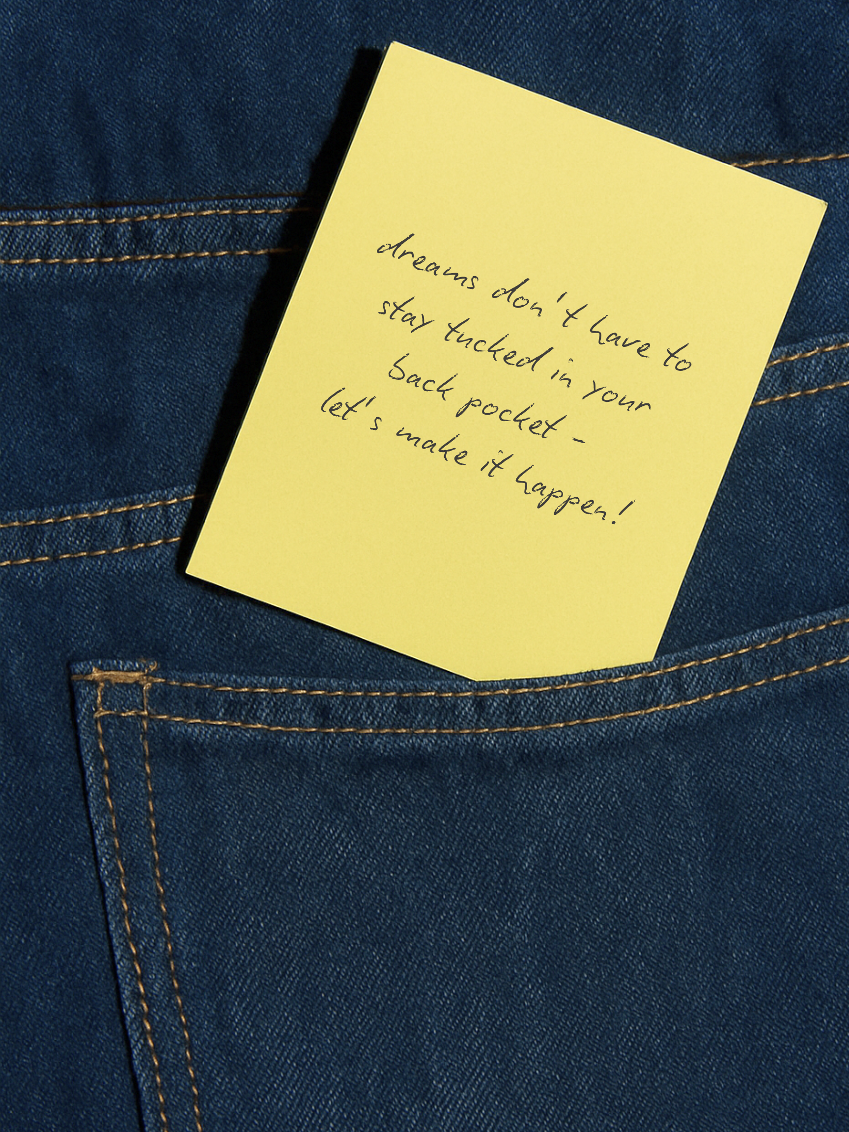 A yellow sticky note with handwritten text placed on a blue denim fabric, specifically near a back pocket.