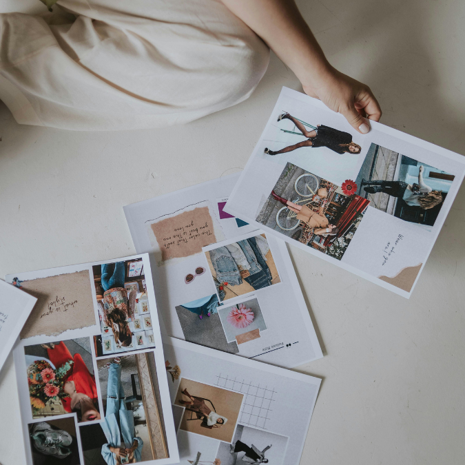 Printed images laid out on the floor during the process of selecting visuals for a vision board