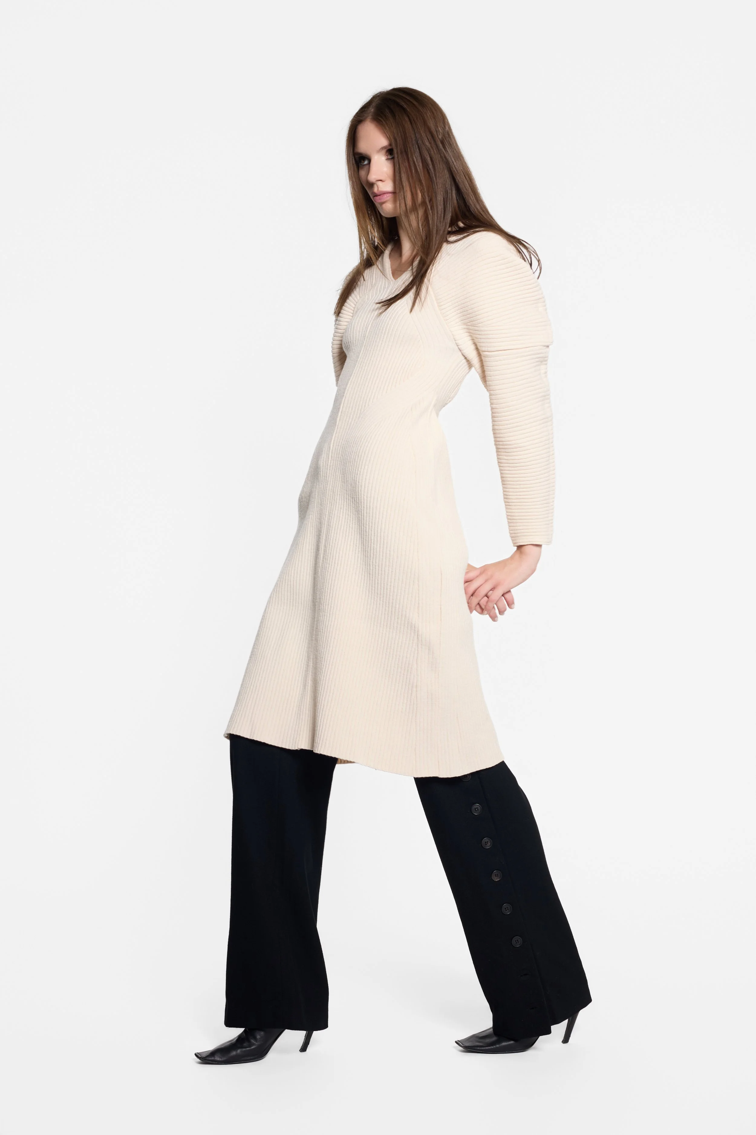 Model wearing IRENE ivory ribbed knit midi dress