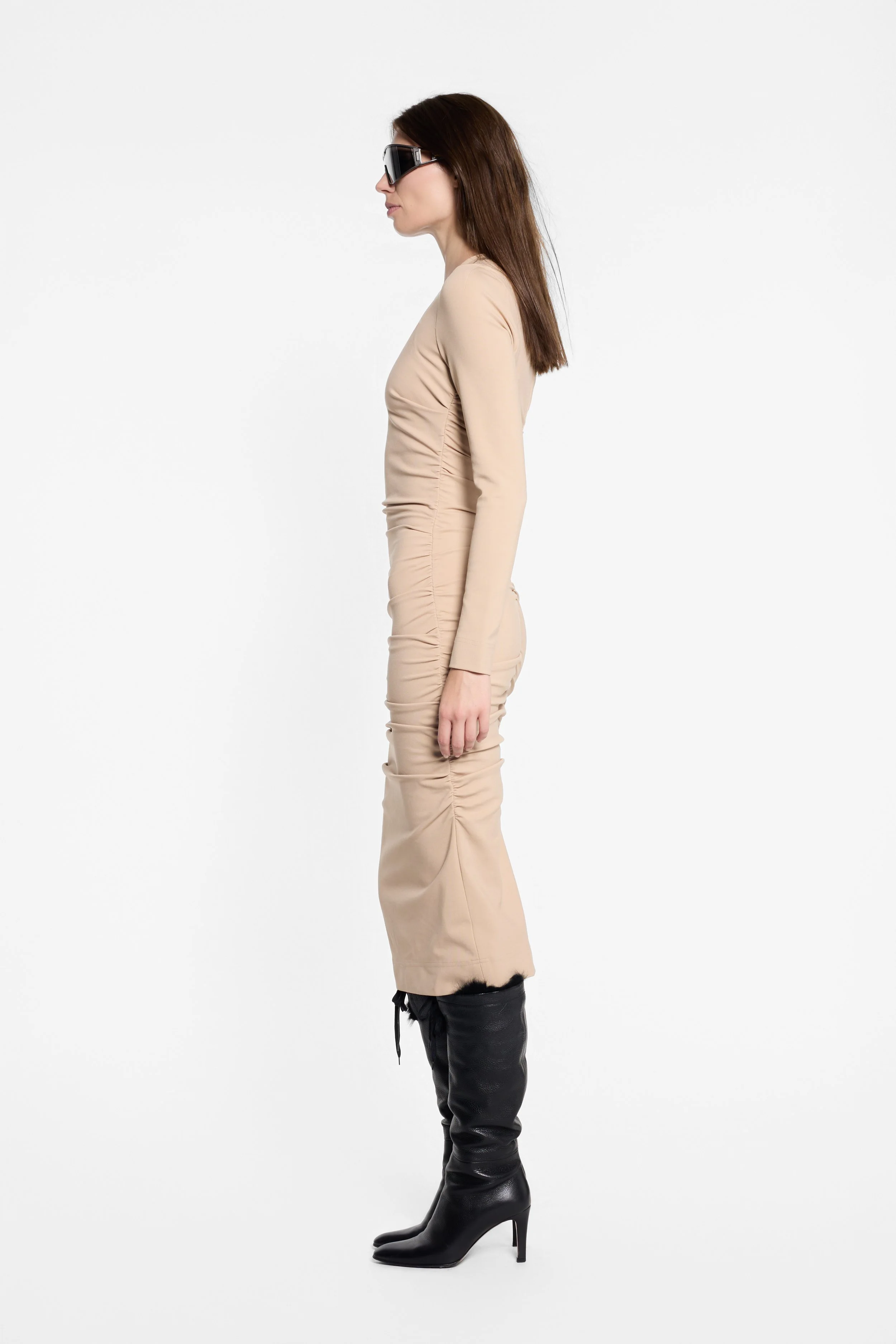 Side view of D&G beige fitted dress with gathered detailing
